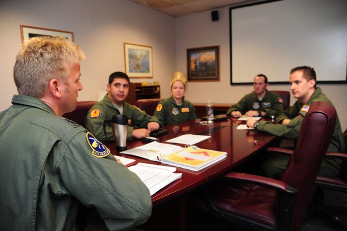 Maj. Sebastian De Mitz, 14th Airlift Squadron German pilot, briefs his aircrew during a mission brief before takeoff Nov. 1, 2012, at Joint Base Charleston – Air Base, S.C. Demitz is part of a pilot exchange program between the U.S. and Germany to build foreign relations and share experiences. His aircrew was tasked to fly to March Reserve Air Force Base, Calif., to pick up supplies and cadaver teams and deliver them to assist with the relief efforts for Hurricane Sandy affecting the Northeast. (U.S. Air Force photo /Staff Sgt. Rasheen Douglas)