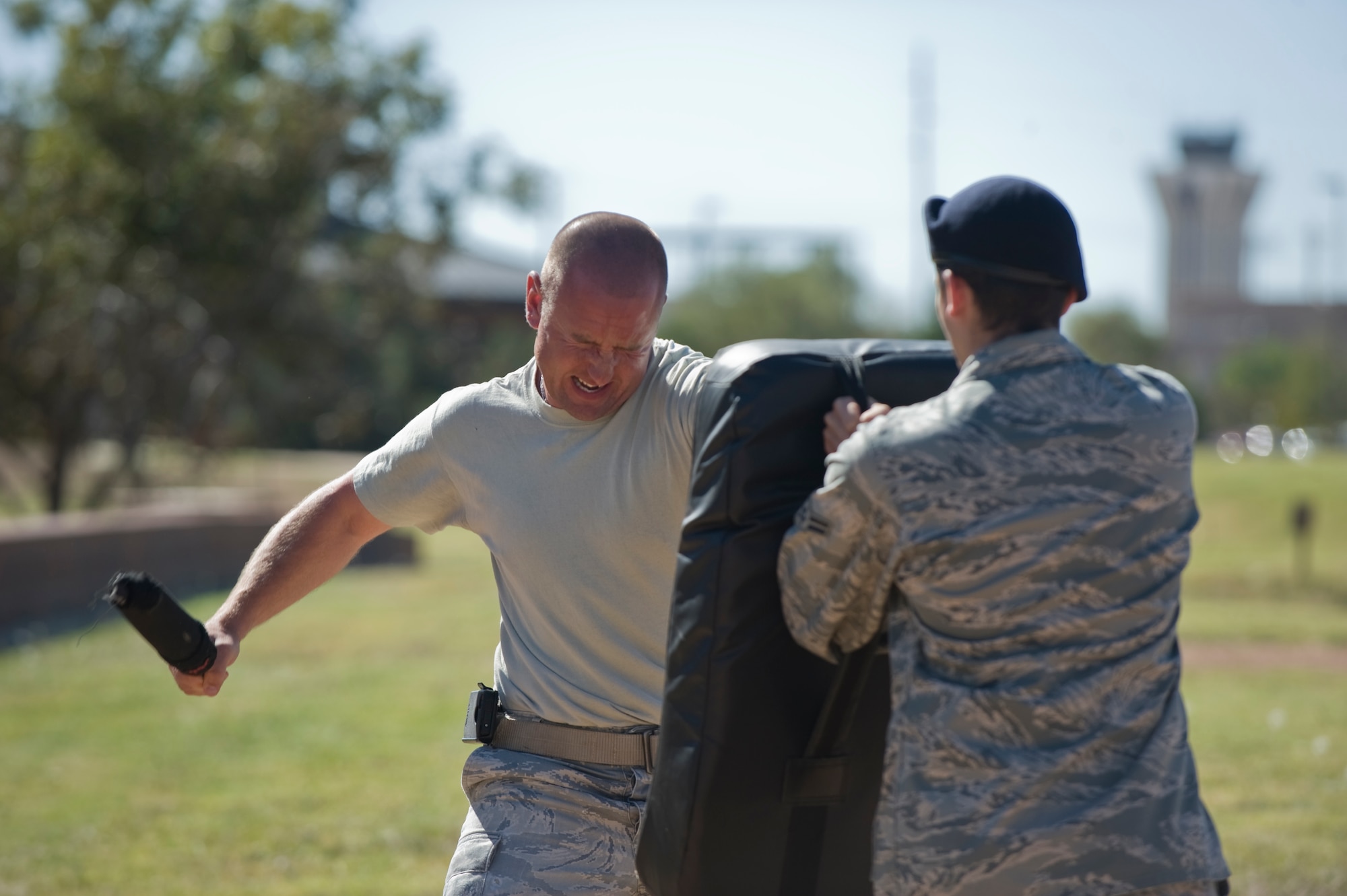 Staff Sgt. Sean Davis, 7th Security Forces Squadron, simulates crowd control while under the effects of Oleoresin Capsicum pepper spray during training Oct. 30, 2012, at Dyess Air Force Base, Texas. Training began with an hour-long class discussing the proper use of the Air Force’s new standard issued pepper spray. After the class, 7th SFS Airmen experienced the effects of the spray while running through a course. (U.S. Air Force photo by Airman 1st Class Jonathan Stefanko/ Released)