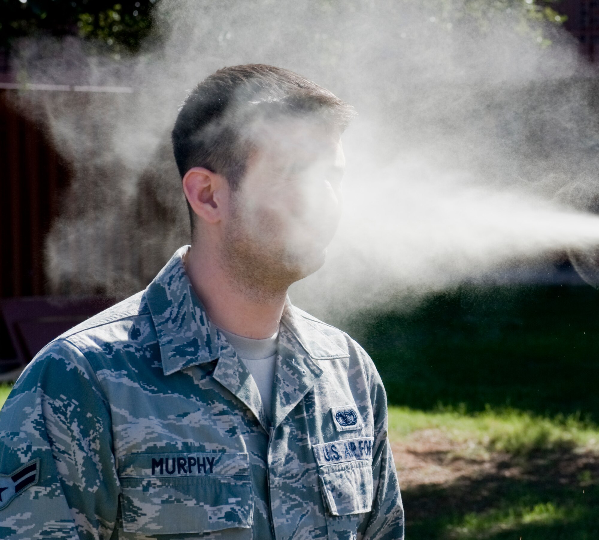 Airman 1st Class Sean Murphy, 7th Security Forces Squadron, is exposed to Oleoresin Capsicum pepper spray during training Oct. 30, 2012, at Dyess Air Force Base, Texas. Training began with an hour-long class discussing the proper use of the Air Force’s new standard issued pepper spray. After the class, 7th SFS Airmen experienced the effects of the spray while running through a course. (U.S. Air Force photo by Airman 1st Class Jonathan Stefanko/ Released) 