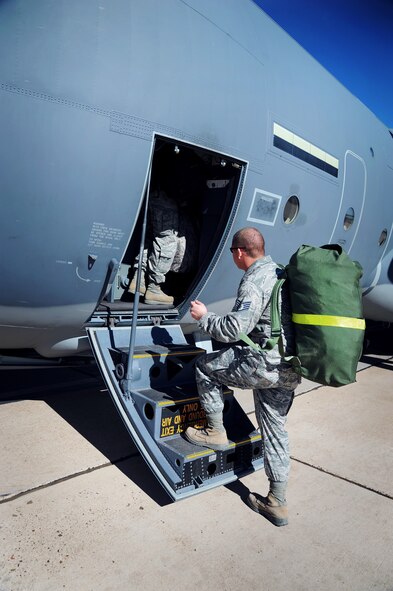 Airmen with the 27th Special Operations Civil Engineer Squadron at Cannon Air Force Base, N.M., board an MC-130J Commando II during an exercise at Melrose Air Force Range, N.M., Oct. 29, 2012. Aircraft maneuvered troops and cargo from agencies across Cannon to better prepare personnel for potential real-world events. (U.S. Air Force photo/Senior Airman Jette Carr)  