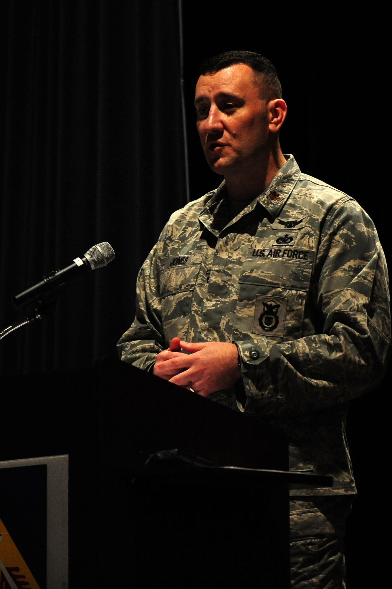 U.S. Air Force Maj. Troy Jones, 4th Security Forces Squadron commander, speaks at a military working dog retirement ceremony on Seymour Johnson Air Force Base, N.C., Oct. 26, 2012. Jones was the presiding official for the ceremony and spoke of the dogs’ contributions during their careers. (U.S. Air Force photo/Airman 1st Class Aubrey White/Released)