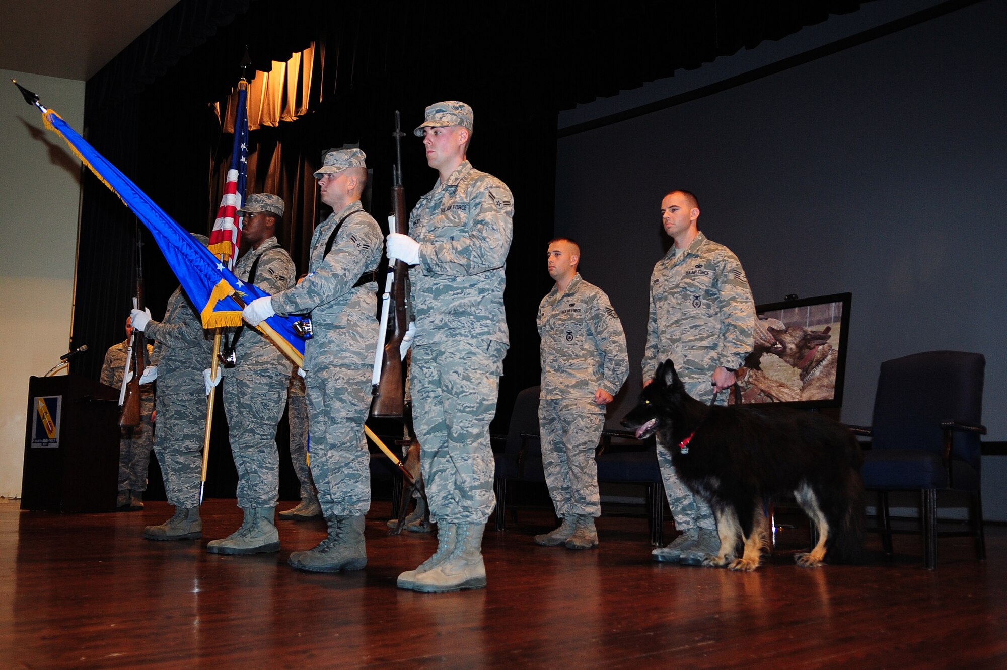 U.S. Air Force Airmen assigned to the 4th Fighter Wing Honor Guard present the colors at a military working dog retirement ceremony on Seymour Johnson Air Force Base, N.C., Oct. 26, 2012. Military working dogs are provided the same honor upon retirement as their active duty counterparts. (U.S. Air Force photo/Airman 1st Class Aubrey White/Released)