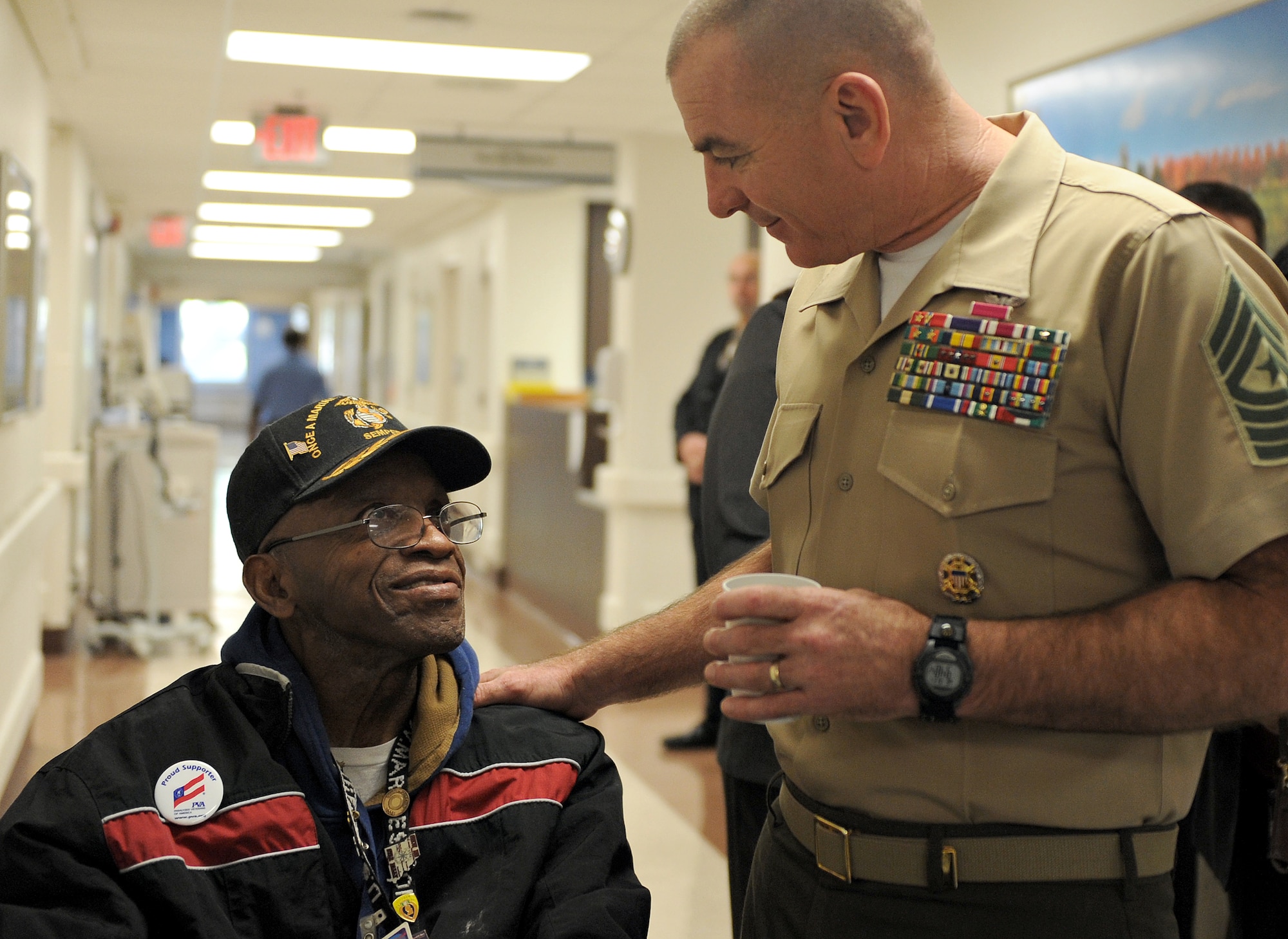 Sgt. Maj. Bryan Battaglia, Senior Enlisted Advisor to the Chairman Joint Chiefs of Staff, speaks with a former Marine while touring a physical medicine and rehabilitation center Oct. 31 in St. Louis, MO. Battaglia serves as the principal advisor to the Chairman and Secretary of Defense on all matters involving joint and combined total force integration, utilization, health of the force and joint development for enlisted personnel. (U.S. Air Force photo/Airman Kris Lynch)