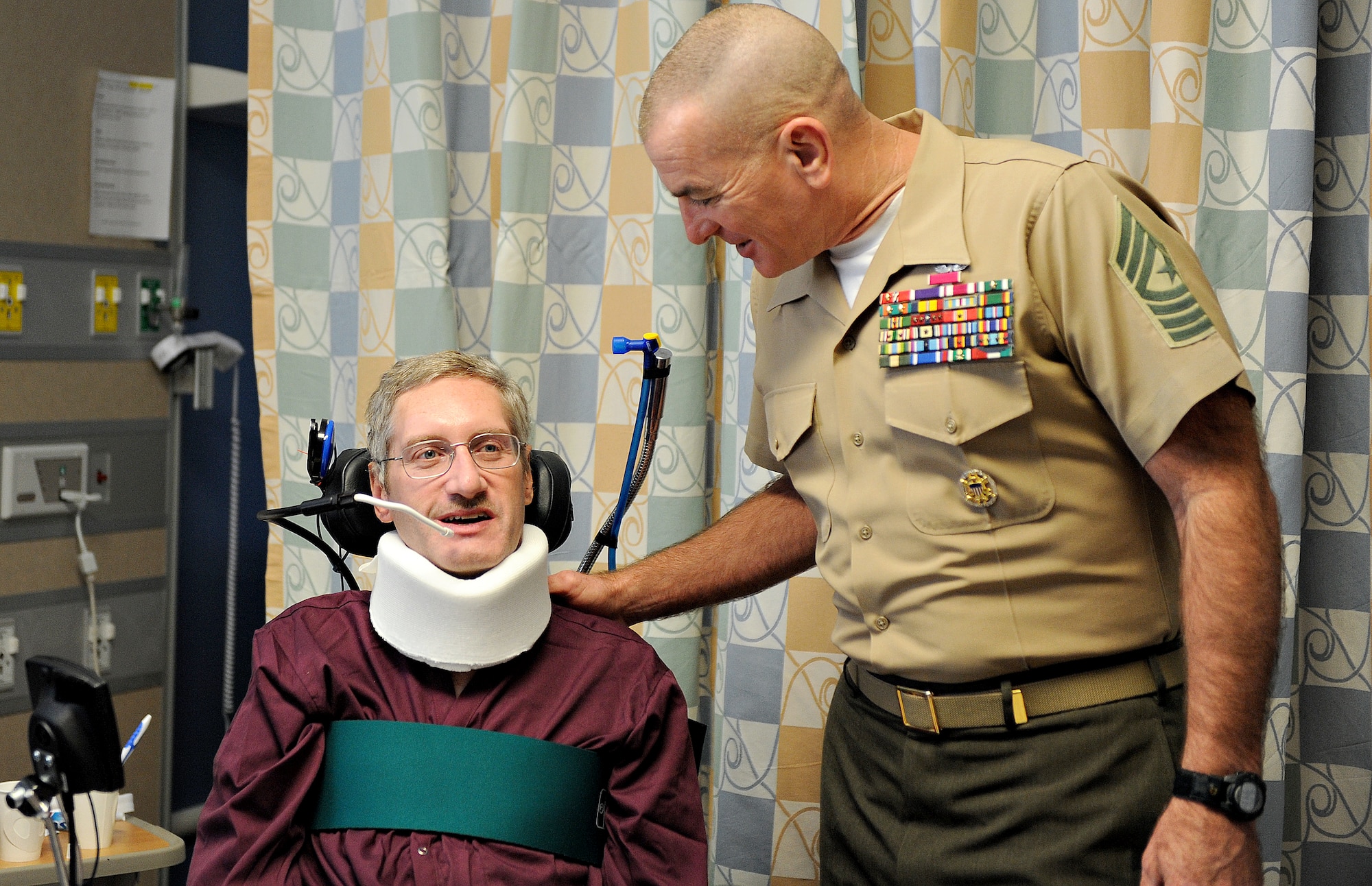 Sgt. Maj. Bryan Battaglia, Senior Enlisted Advisor to the Chairman Joint Chiefs of Staff, speaks with a veteran who is undergoing spinal treatment Oct. 31 in St. Louis, MO. Battaglia serves as the principal advisor to the Chairman and Secretary of Defense on all matters involving joint and combined total force integration, utilization, health of the force and joint development for enlisted personnel. (U.S. Air Force photo/Airman Kris Lynch)