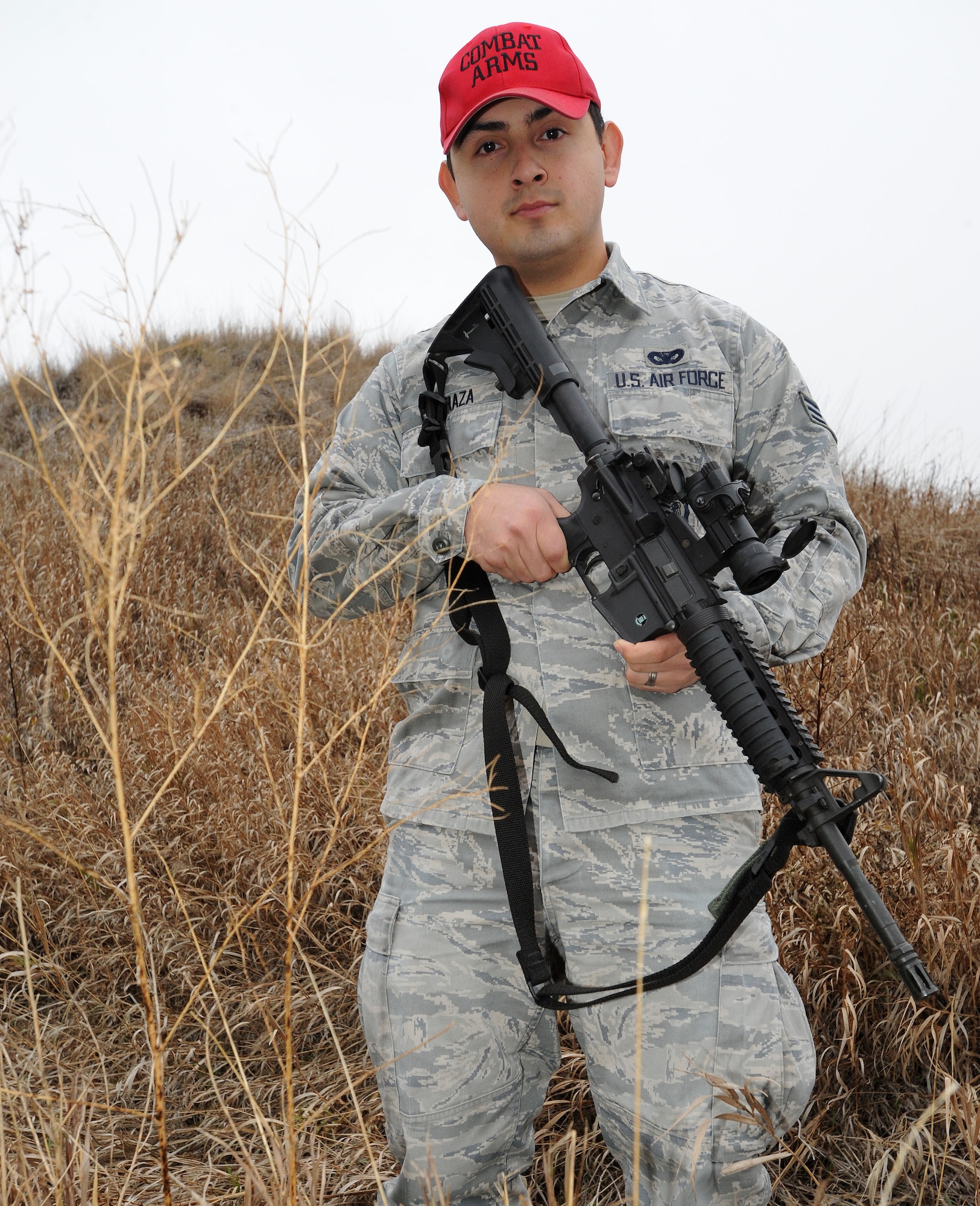 Senior Airman Jesus Barraza, 319th Security Forces Squadron combat arms instructor, stands at the low ready position outside the Combat Arms Training and Maintenance building Nov. 2, 2012, on Grand Forks Air Force Base, N.D. Barraza is qualified on more than five different weapons and is a marksman on the M-4 carbine and the M-9 handgun. (U.S. Air Force photo/Airman 1st Class Zachiah Roberson)