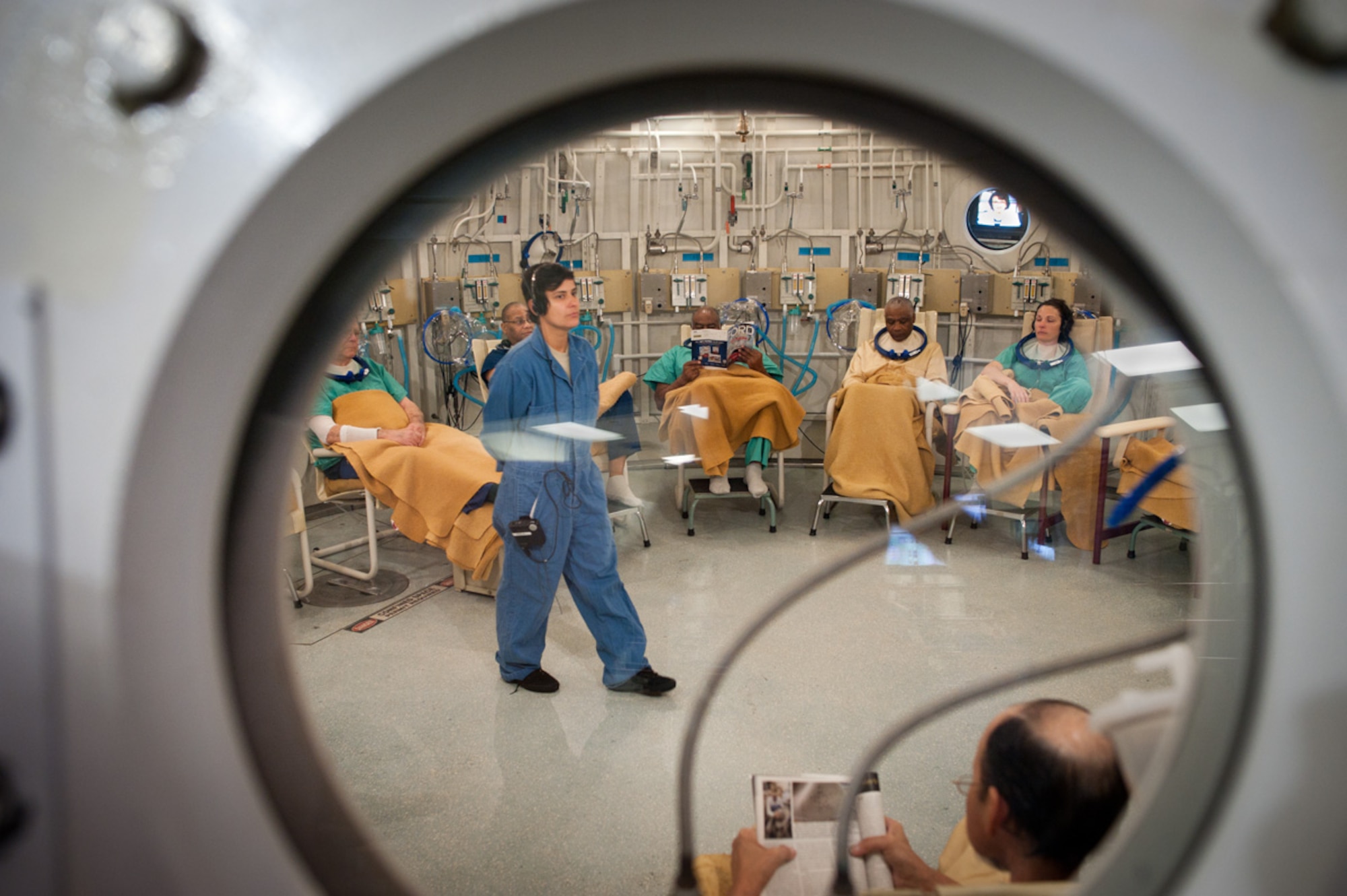 1st Lt. Andrea Deoliveira, a 60th Medical Group Aerospace Physiology nurse, waits inside the hyperbaric chamber with her patients minutes before a dive. (U.S. Air Force Photo/Ken Wright)