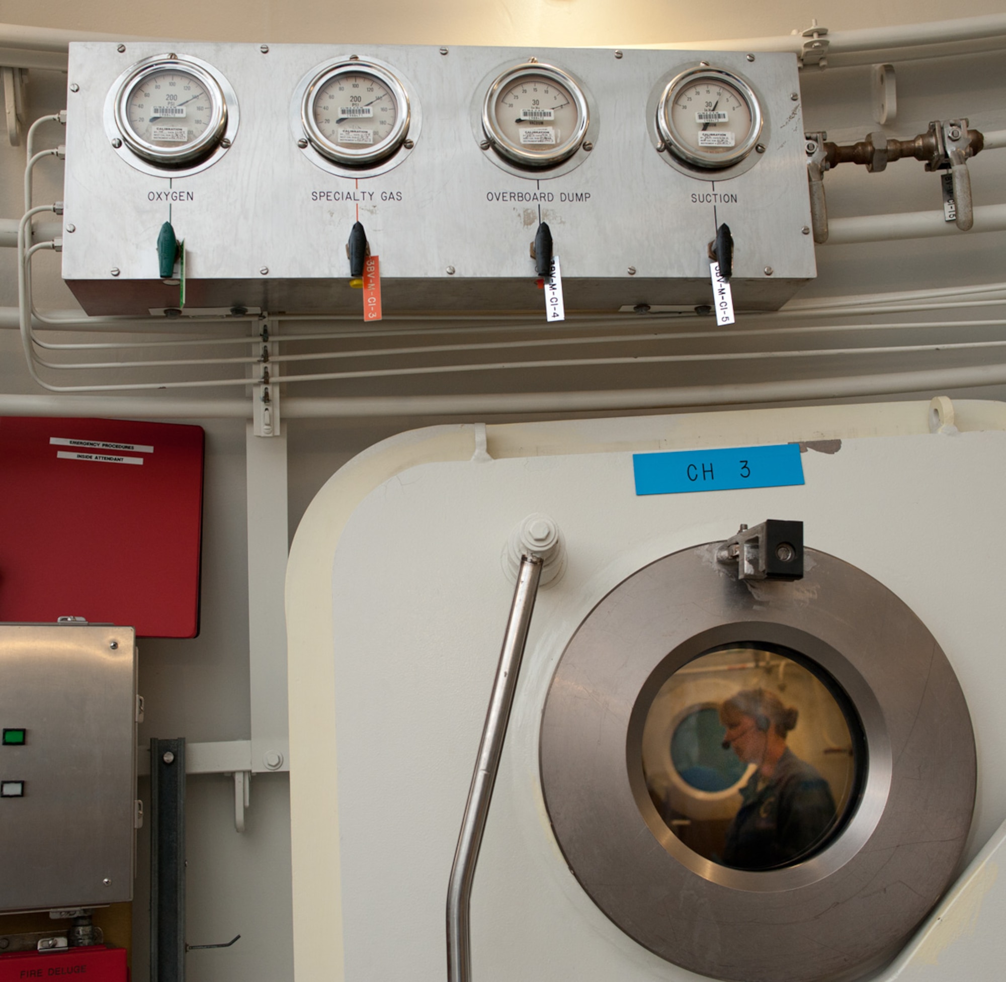 Gauges and monitoring equipment inside and outside the hyperbaric chamber at David Grant Medical Center help staff keep a close eye on the oxygen rich environment produced for patients. (U.S. Air Force Photo/Ken Wright)