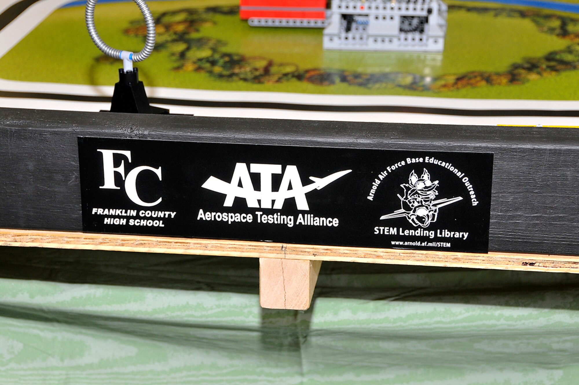 The students added a special logo to each of the seven tables they built for Arnold Engineering Development Center’s educational outreach. (Photo by Jackie Cowan)