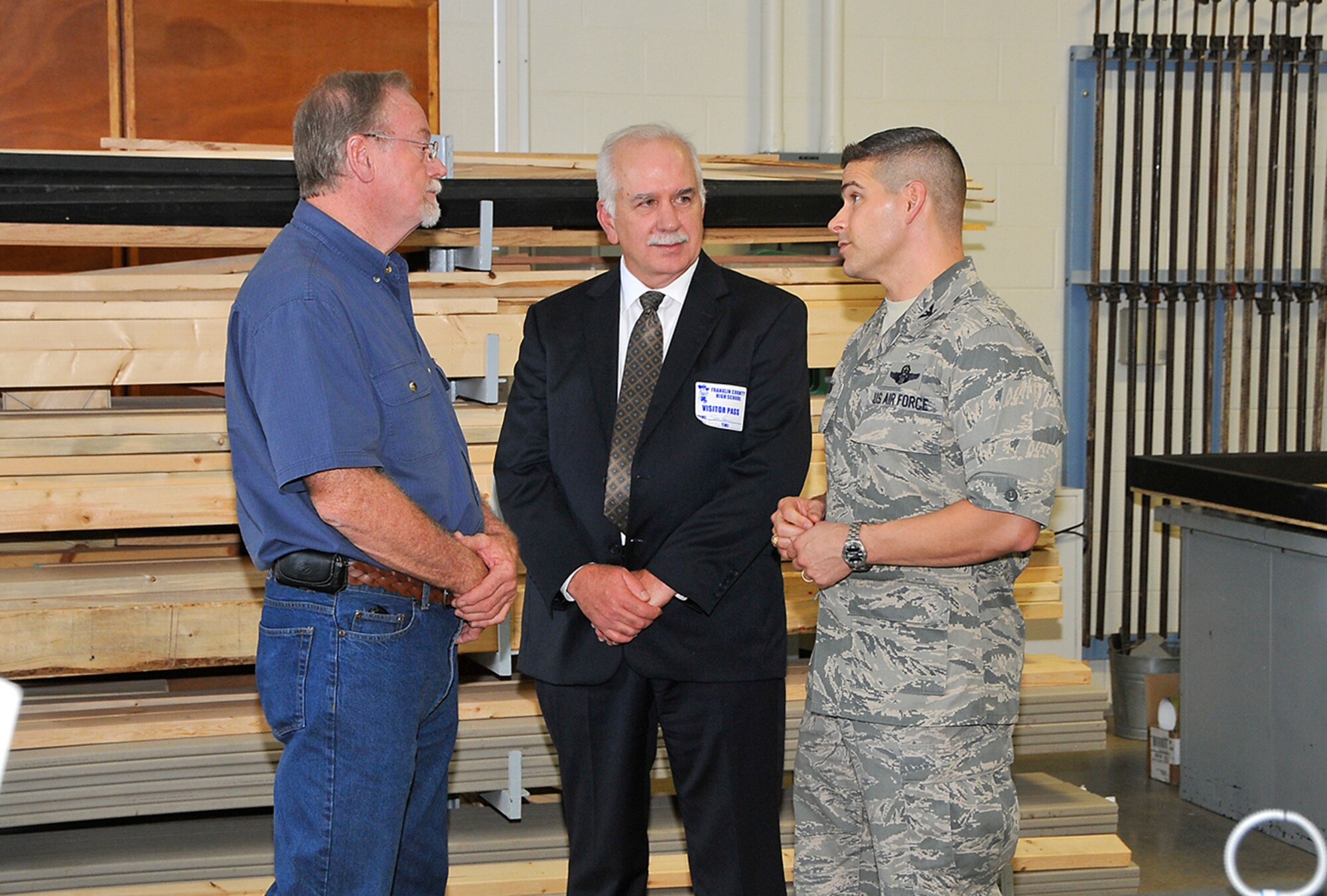 (left to right) Franklin County High School instructor, Jerry Venson, talks with Aerospace Testing Alliance General Manager, Steve Pearson and AEDC Commander, Col. Raymond Toth after a ceremony in which FCHS gave AEDC leadership tables students built for AEDC’s educational outreach program. (Photo by Jackie Cowan) 