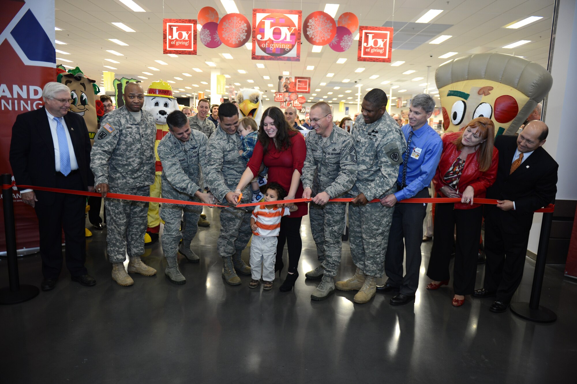 SPANGDAHLEM AIR BASE, Germany – Base and Exchange leadership cut a ribbon at the grand opening ceremony of the Spangdahlem Exchange Nov. 2, 2012.  Construction of the $30 million, 112,000 square foot facility began for the new Exchange in October 2010, and the $30 million, 112,000 square foot facility replaces replacing the Spangdahlem’s previous 15,446 square foot Exchange. (U.S. Air Force photo by Airman 1st Class Gustavo Castillo/Released)