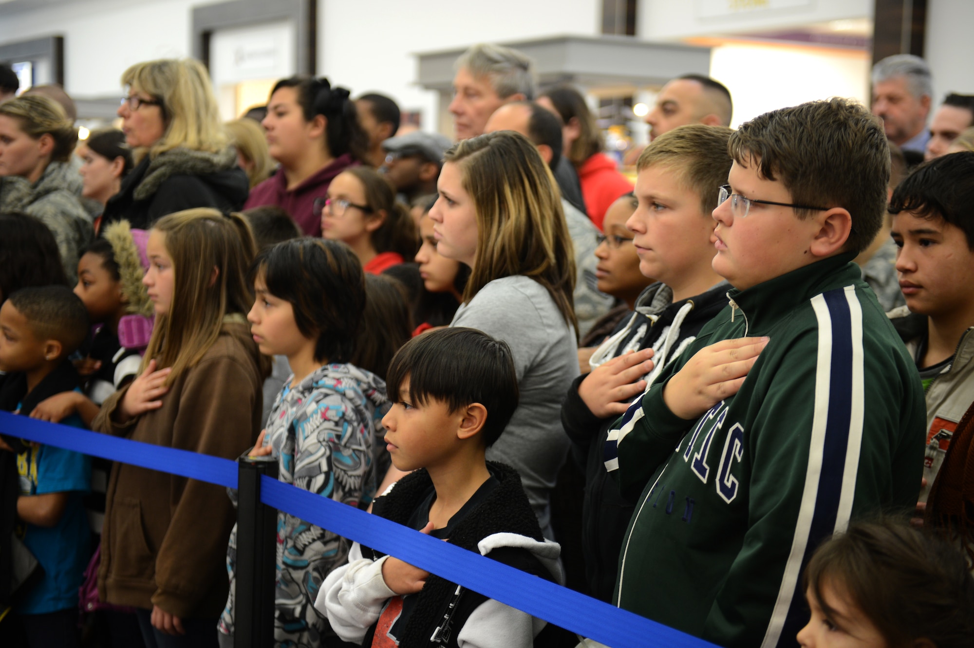 SPANGDAHLEM AIR BASE, Germany – A crowd stands for the German and American national anthems during the grand opening ceremony of the Spangdahlem Exchange Nov. 2, 2012.  Hundreds of members from the Eifel community attended the opening ceremony. (U.S. Air Force photo by Airman 1st Class Gustavo Castillo/Released)