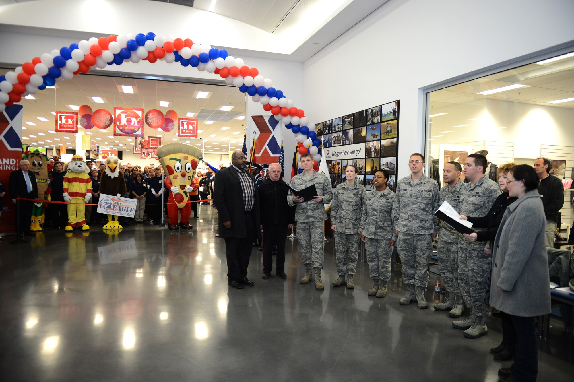SPANGDAHLEM AIR BASE, Germany – The Saber Singers perform during the grand opening ceremony of the Spangdahlem Exchange Nov. 2, 2012.  The new Exchange includes the main retail store, a flower shop, military clothing sales, alterations and dry cleaning services, a barber shop, a food court and various concessionaires with a goal to provide a convenient one-stop shopping experience for the Spangdahlem community. (U.S. Air Force photo by Airman 1st Class Gustavo Castillo/Released)
