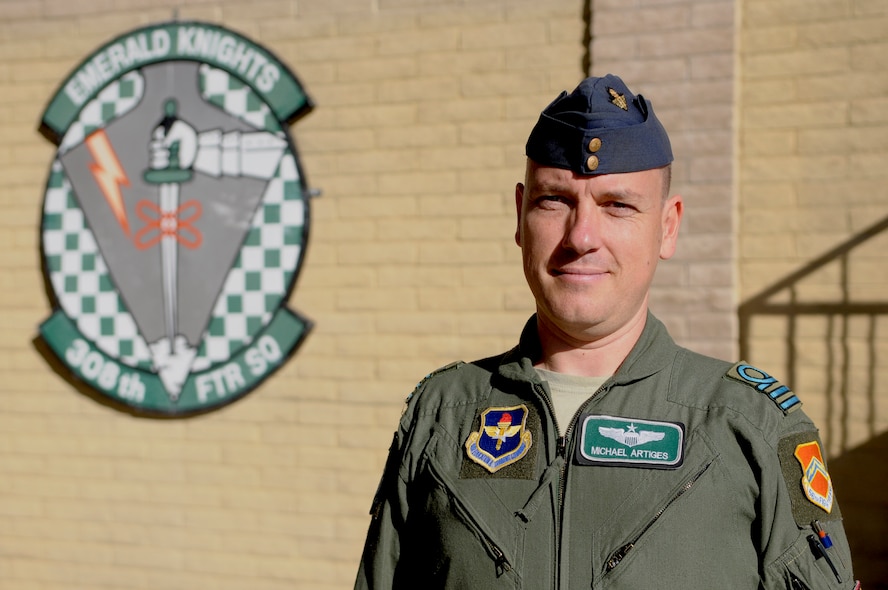 Belgian Commandant Michael Artiges stands in front of his new home, the 308th Fighter Squadron. He came to Luke Air Force Base as part of the Military Personnel Exchange Program to serve an instructor pilot for three years.  The MPEP at Luke has 10 positions – seven pilots, two maintenance officers and one logistics officer. (U.S. Air Force photo by Staff Sgt. C.J. Hatch)