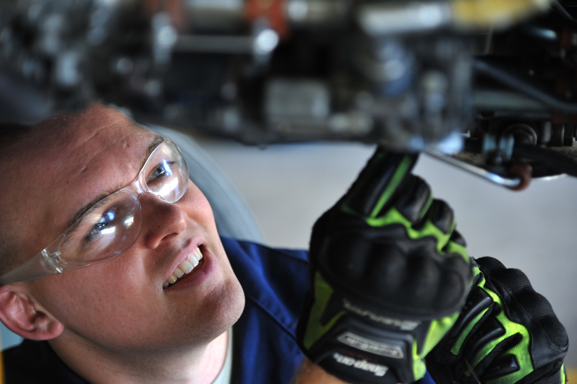 Staff Sgt. Nathan Varnagatas safety wires fuel tubes after a test cell run at hush house two at Luke Air Force Base. (U.S. Air Force photo by Senior Airman Sandra Welch)