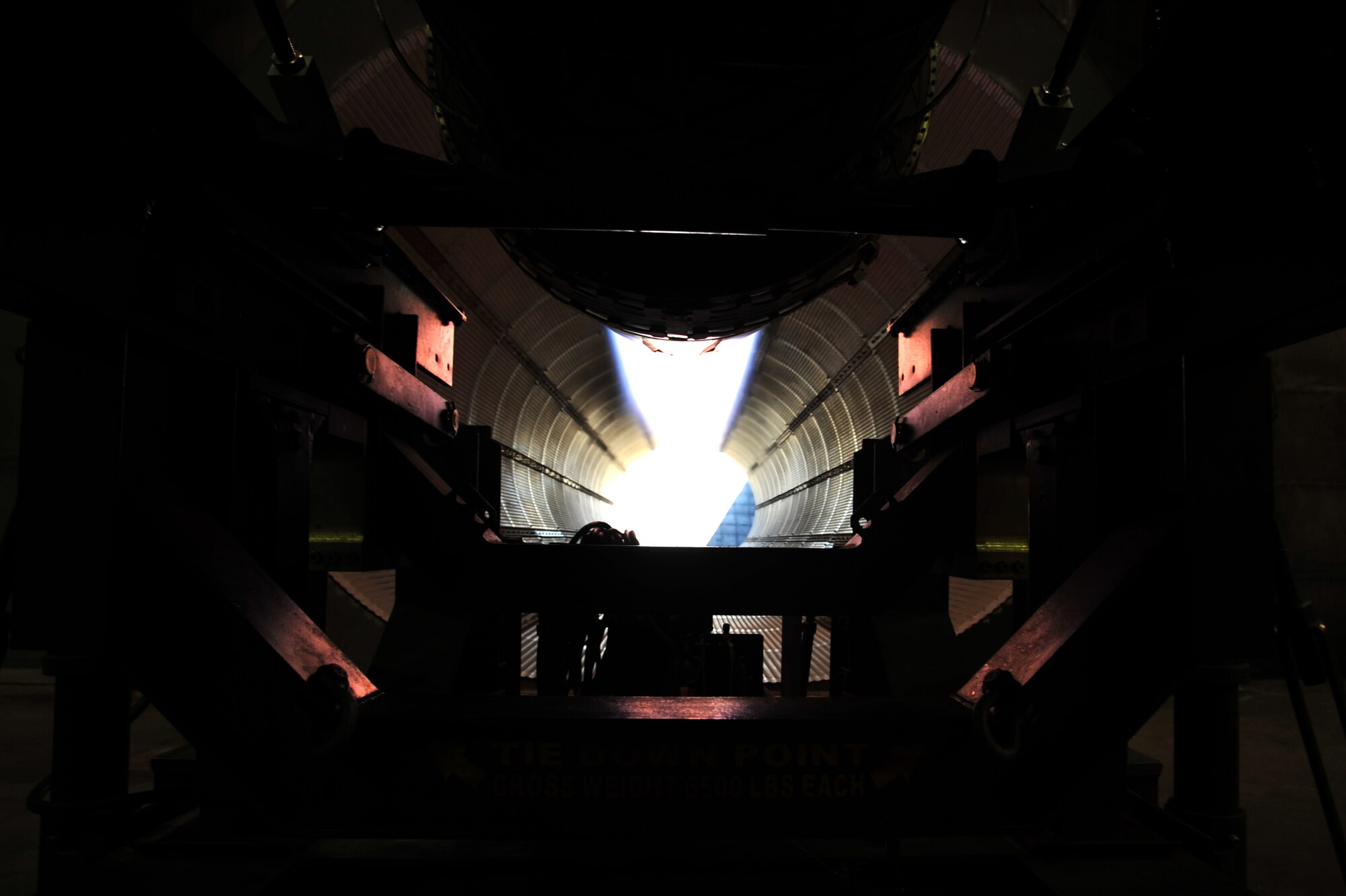 An engine runs at full afterburner viewed from under the engine at hush house two. The hush houses are located together on the south end of the base near the 944th Fighter Wing. (U.S. Air Force photo by Senior Airman Sandra Welch)