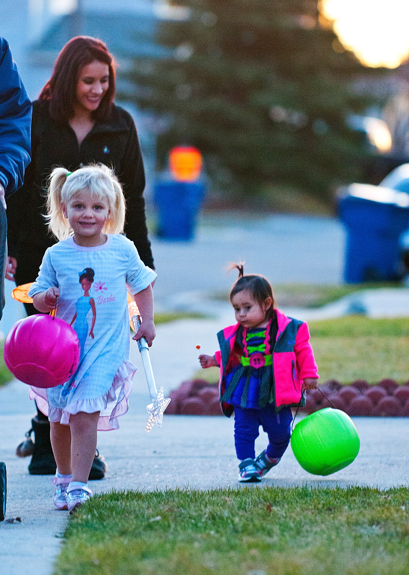 Emilie Beach, 3, and Natalia Gonzalez, 1, head out trick-or-treating n F.E. Warren Air Force Base housing on Halloween. Beach is the daughter of Victoria and Staff Sgt. Kenneth Beach, 90th Maintenance Operations Squadron, and Gonzalez is the daughter of Christina and Senior Airman Johnathon Gonzalez, 90th Security Forces Squadron. (U.S. Air Force photo by R.J. Oriez)
