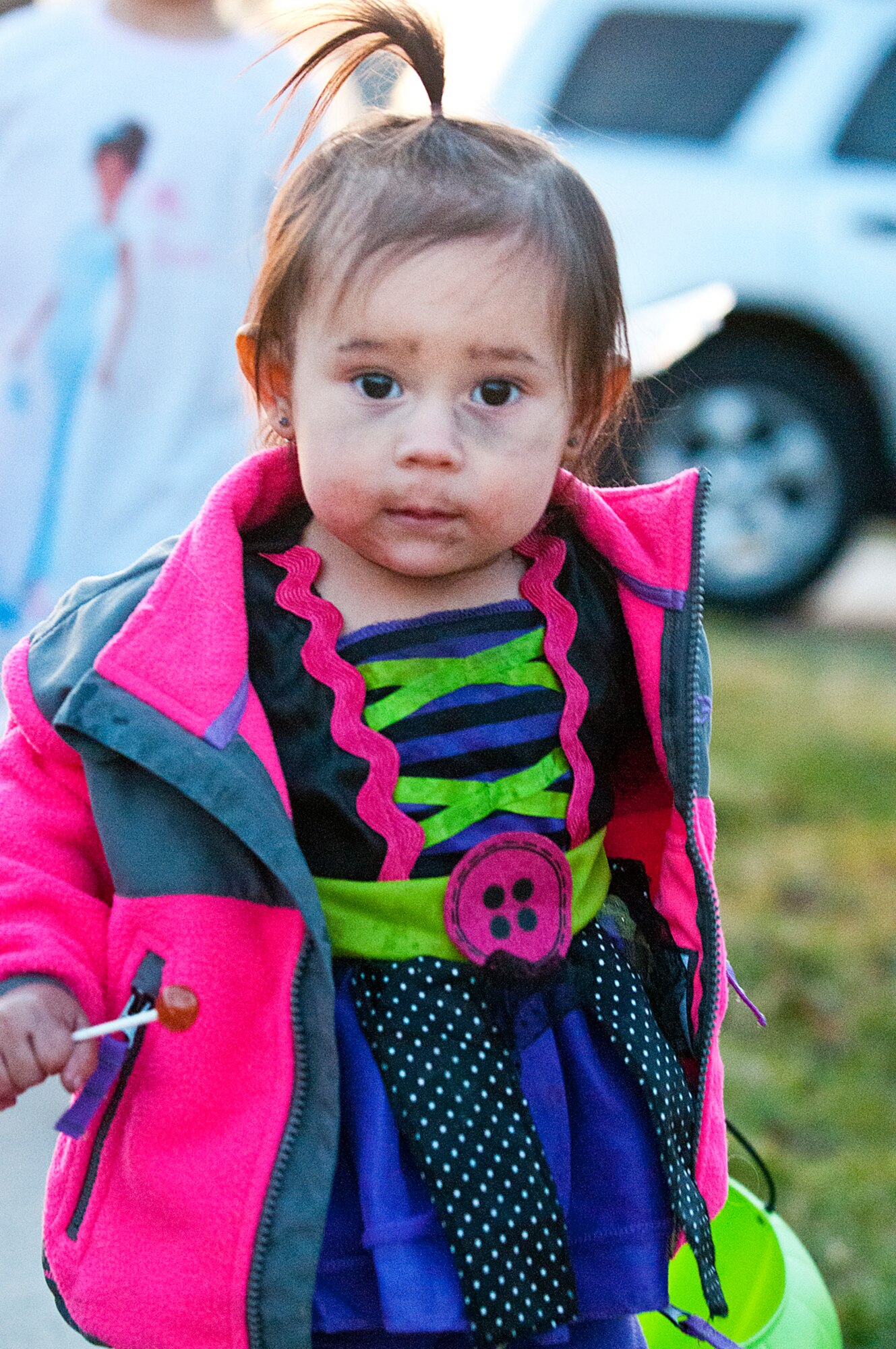 Natalia Gonzalez, 1, gets an early start on her spoils from trick-or-treating in F.E. Warren's housing on Halloween. Gonzalez is the daughter of Christina and Senior Airman Johnathon Gonzalez, 90th Security Forces Squadron. (U.S. Air Force photo by R.J. Oriez)