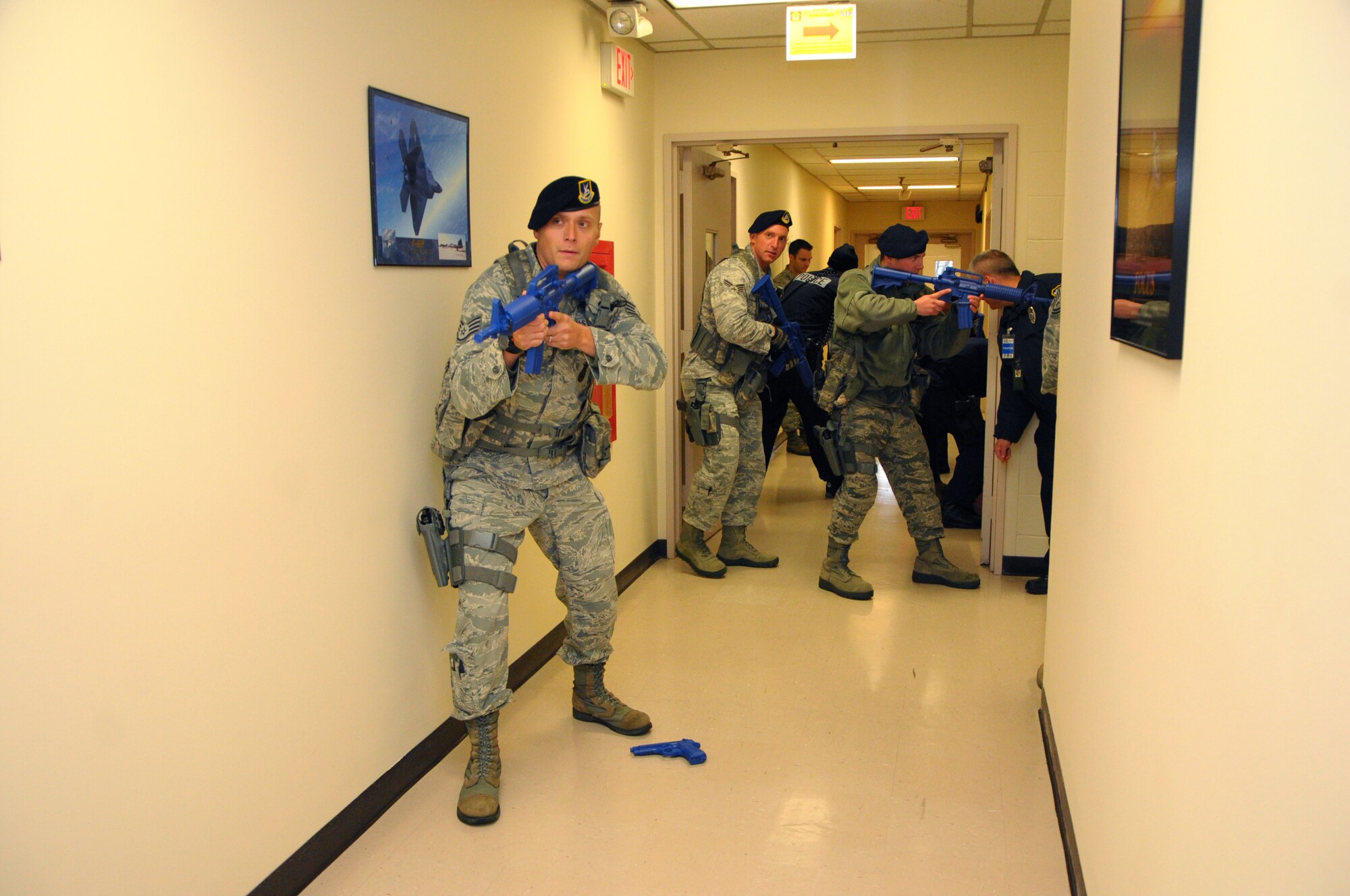 A Security Forces contact team makes a sweep of Bldg. 676, the Air Force Research Laboratory’s DOD Supercomputing Resource Center, to secure the building during the active shooter exercise Oct. 30.  (photo by Niki Jahns)