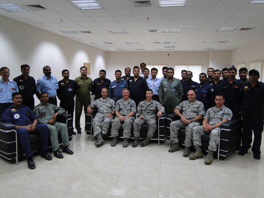 Master Sergeant Joe Delfino, Technical Sergeant Kevin Hunt, Staff Sergeant Matt Elderkin, Chief Master Sergeant Carlos Moniz and Captain Chris Peloso, all of the 143d Maintenance Group and members of the Mobile Training Team for the Indian Air Force, pose with some of their students. Provided photo.