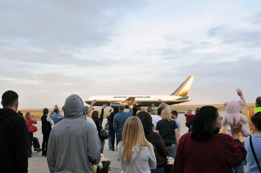 Friends and family wave goodbye to their loved ones at Buckley Air Force Base Colo., Nov 01, 2012.  Members of the 140th Wing, Colorado Air National Guard, have been taking off from Buckley AFB, Colo. this week, headed to a forward operating location in support of Air Force Central Command. These pilots, aircraft maintainers and support personnel will be deployed throughout the holiday season in order to support the ongoing Overseas Contingency Operations. (Colorado Air National Guard photo by Tech. Sgt. Wolfram M. Stumpf)