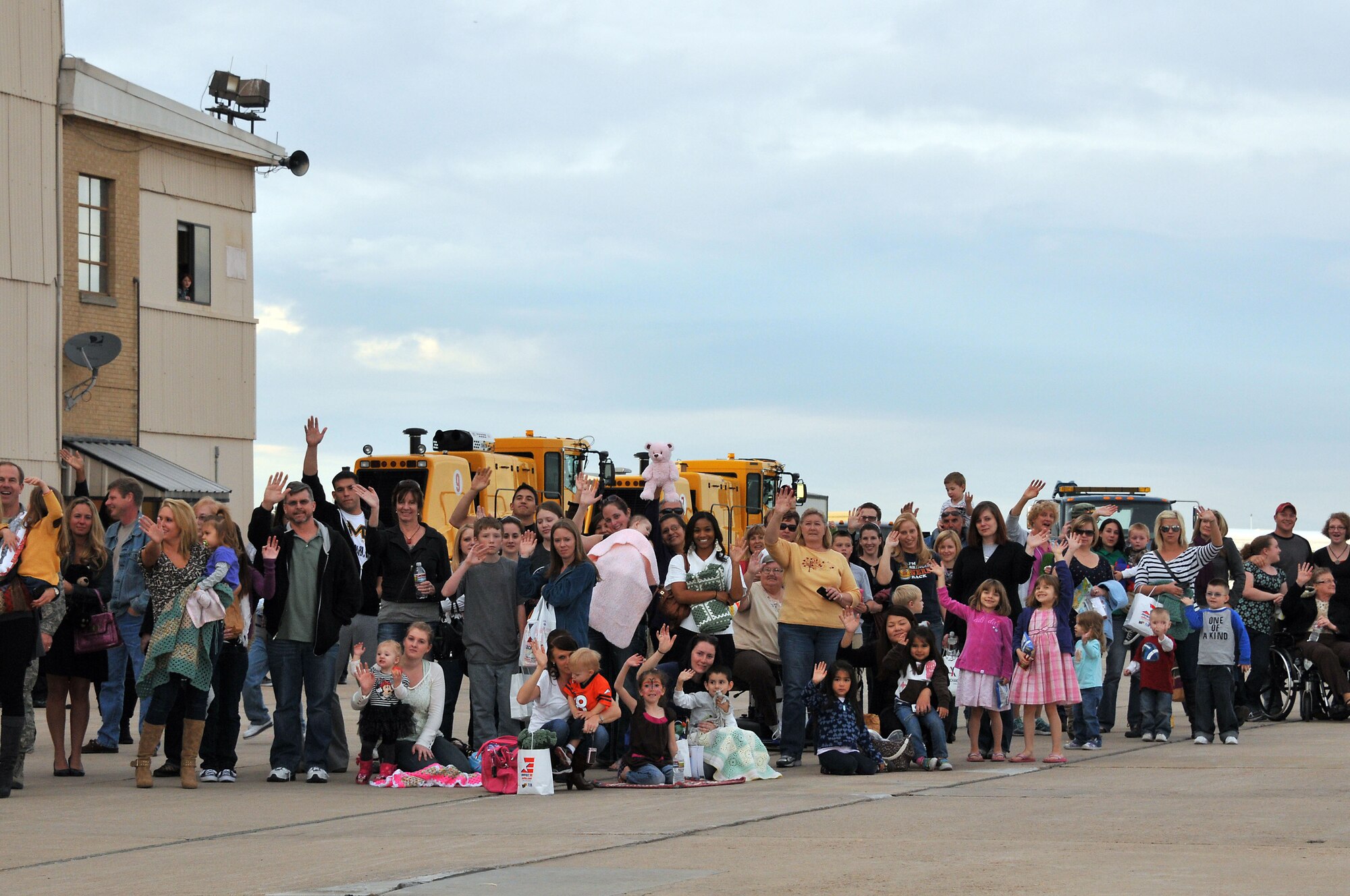 Friends and family wave goodbye to their loved ones at Buckley Air Force Base Colo., Nov 01, 2012.  Members of the 140th Wing, Colorado Air National Guard, have been taking off from Buckley AFB, Colo. this week, headed to a forward operating location in support of Air Force Central Command. These pilots, aircraft maintainers and support personnel will be deployed throughout the holiday season in order to support the ongoing Overseas Contingency Operations. (Colorado Air National Guard photo by Tech. Sgt. Wolfram M. Stumpf)
