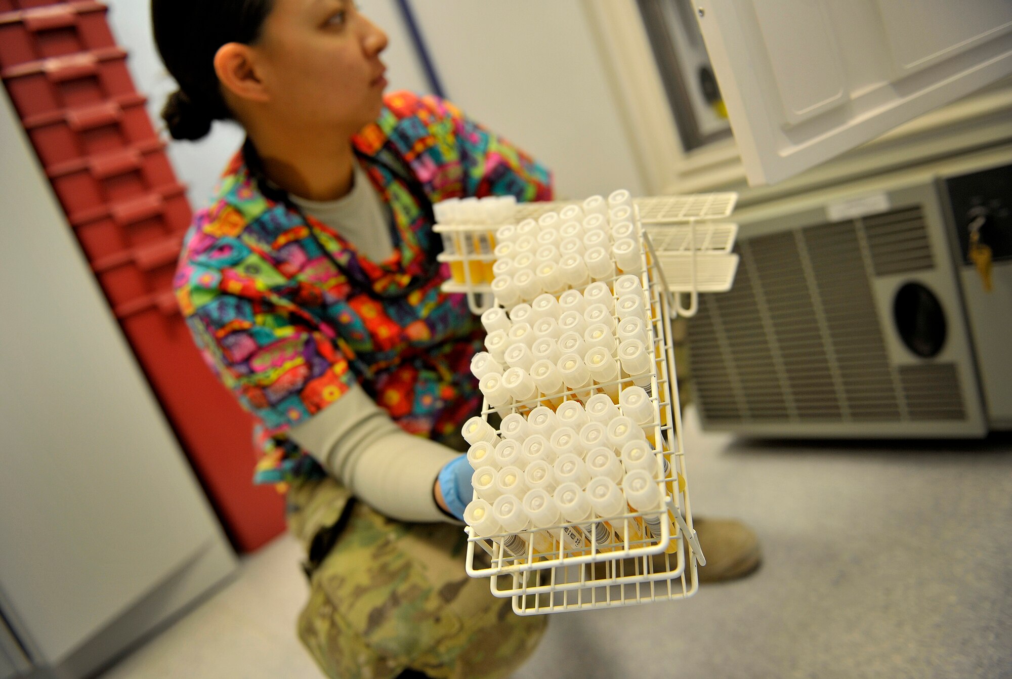 U.S. Air Force Senior Airman Aleza Chan, medical lab technician, 966th Air Expeditionary Squadron, goes through the lengthy process of testing blood from donors at the blood testing section of the NATO Role 3 Hospital, Kandahar Airfield, Afghanistan, Oct. 25, 2012. Chan is part of a five-person Air Force team that runs the apheresis program at the hospital, which helps to collect blood platelets donated by members at Kandahar. The platelets are then stored and later used to help promote blood clotting in trauma patients injured in combat. The apheresis section helps to collect platelets for not only patients at Kandahar, but also for 14 other Forward Operating Bases in Afghanistan. (U.S. Air Force photo/Staff Sgt. Clay Lancaster)