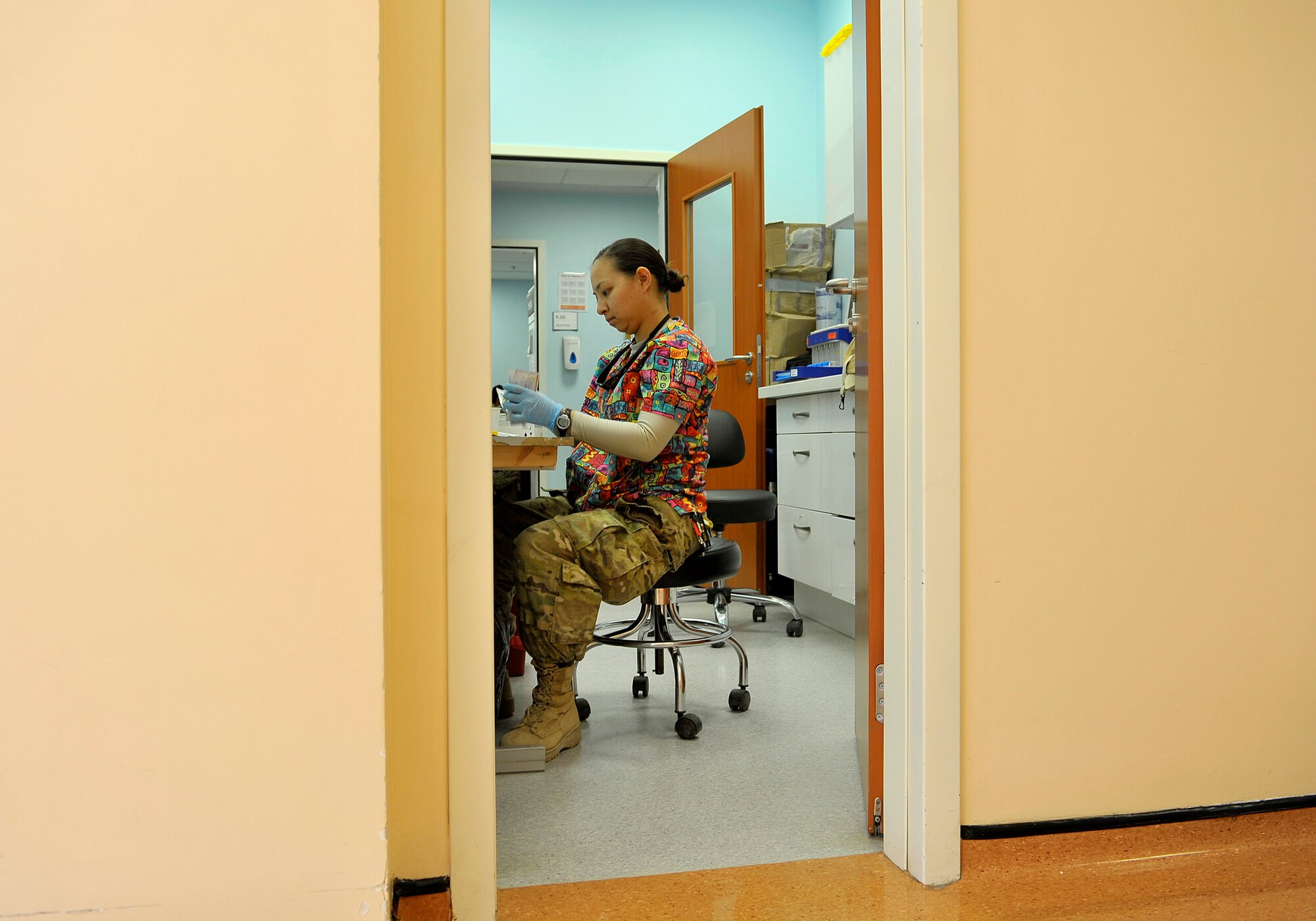 U.S. Air Force Senior Airman Aleza Chan, medical lab technician, 966th Air Expeditionary Squadron, goes through the lengthy process of testing blood from donors at the blood testing section of the NATO Role 3 Hospital, Kandahar Airfield, Afghanistan, Oct. 25, 2012. Chan is part of a five-person Air Force team that runs the apheresis program at the hospital, which helps to collect blood platelets donated by members at Kandahar. The platelets are then stored and later used to help promote blood clotting in trauma patients injured in combat. The apheresis section helps to collect platelets for not only patients at Kandahar, but also for 14 other Forward Operating Bases in Afghanistan. (U.S. Air Force photo/Staff Sgt. Clay Lancaster)