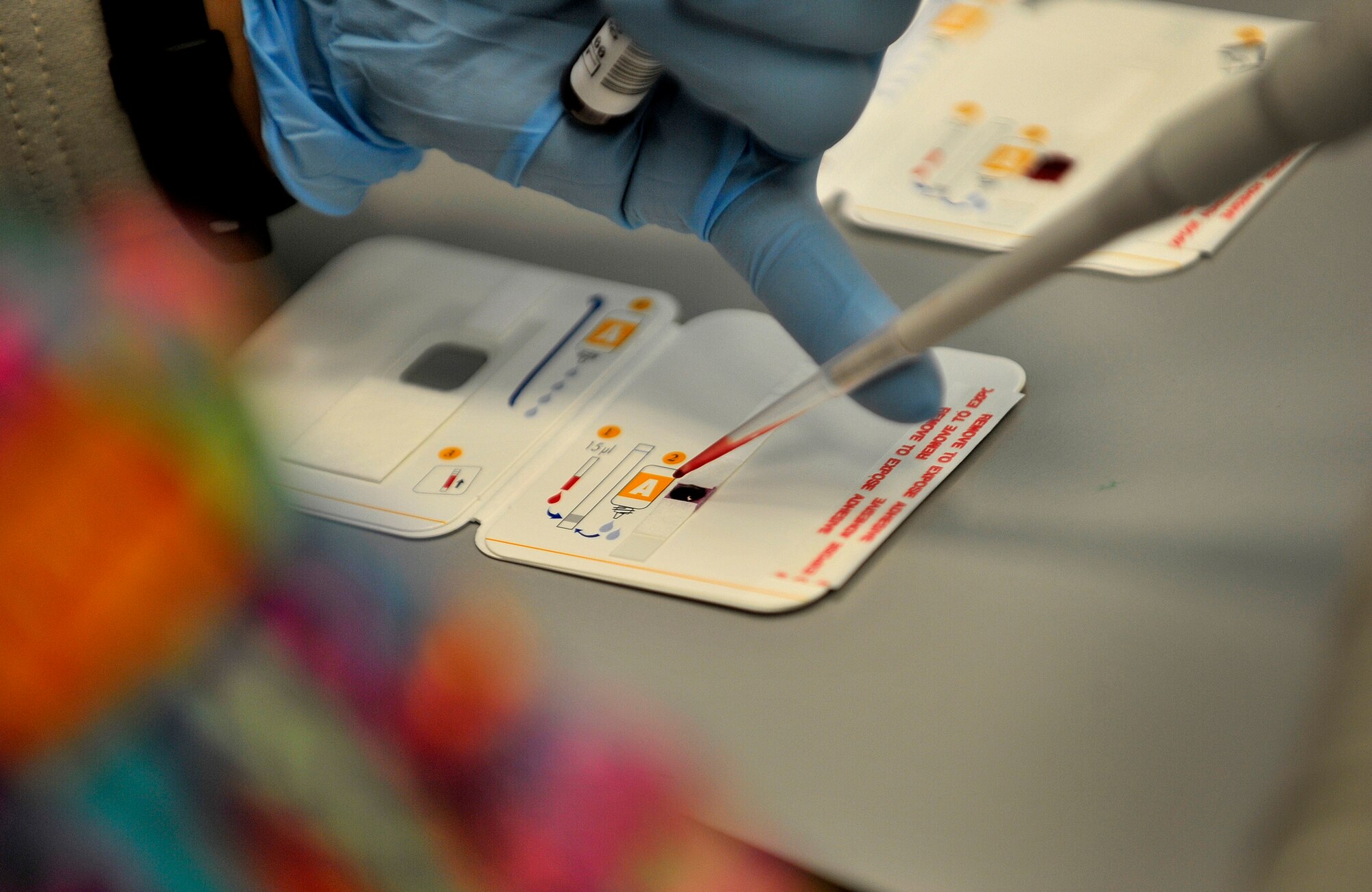 U.S. Air Force Senior Airman Aleza Chan, medical lab technician, 966th Air Expeditionary Squadron, goes through the lengthy process of testing blood from donors at the blood testing section of the NATO Role 3 Hospital, Kandahar Airfield, Afghanistan, Oct. 25, 2012. Chan is part of a five-person Air Force team that runs the apheresis program at the hospital, which helps to collect blood platelets donated by members at Kandahar. The platelets are then stored and later used to help promote blood clotting in trauma patients injured in combat. The apheresis section helps to collect platelets for not only patients at Kandahar, but also for 14 other Forward Operating Bases in Afghanistan. (U.S. Air Force photo/Staff Sgt. Clay Lancaster)