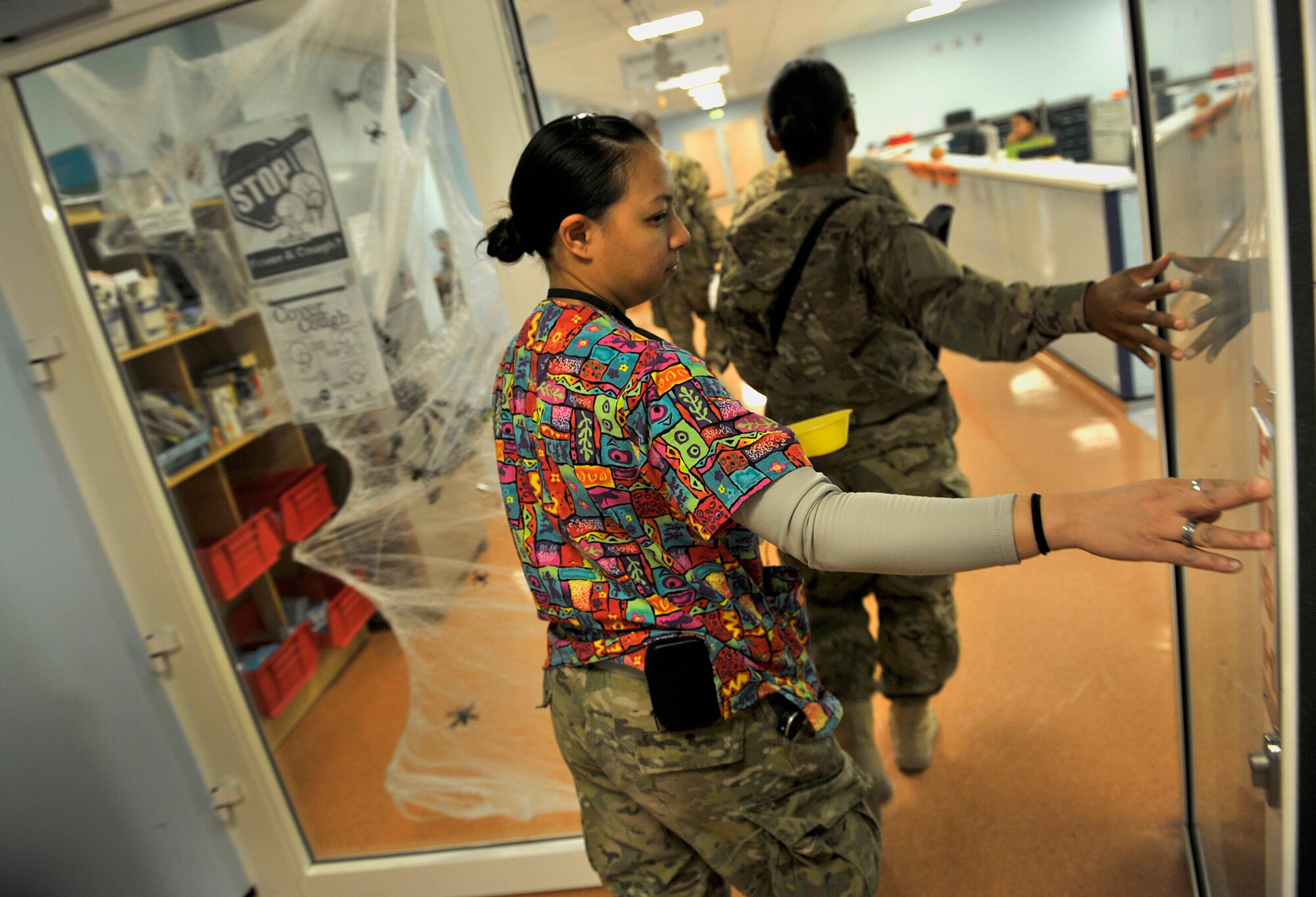 U.S. Air Force Senior Airman Aleza Chan, medical lab technician, 966th Air Expeditionary Squadron, makes her way to the blood testing section at the NATO Role 3 Hospital, Kandahar Airfield, Afghanistan, Oct. 25, 2012. Chan is part of a five-person Air Force team that runs the apheresis program at the hospital, which helps to collect blood platelets donated by members at Kandahar. The platelets are then stored and later used to help promote blood clotting in trauma patients injured in combat. The apheresis section helps to collect platelets for not only patients at Kandahar, but also for 14 other Forward Operating Bases in Afghanistan. (U.S. Air Force photo/Staff Sgt. Clay Lancaster)