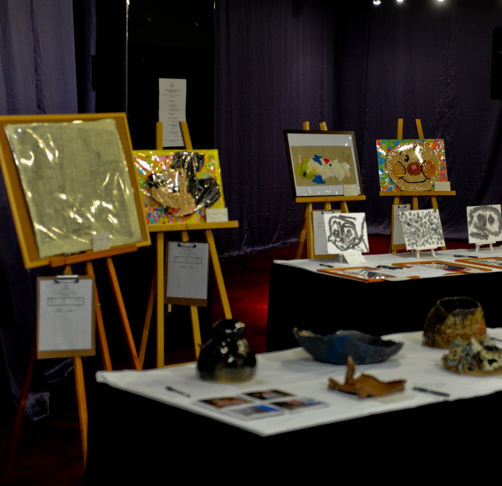 Pieces of artwork up for aution are put on display during the Kadena Special Olympics Art Auction in Okinawa, Japan, Nov.2, 2012. The pieces of art were donated by athletes participating in the KSO and all proceeds goes directly towards the upcomming KSO, Nov. 17th. The KSO began in 2000 with approximately 400 athletes and 600 volunteers as an 18th Wing community goodwill initiative to strengthen U.S.-Okinawa relationships. (U.S. Air Force photo/Airman 1st Class Justin Veazie)