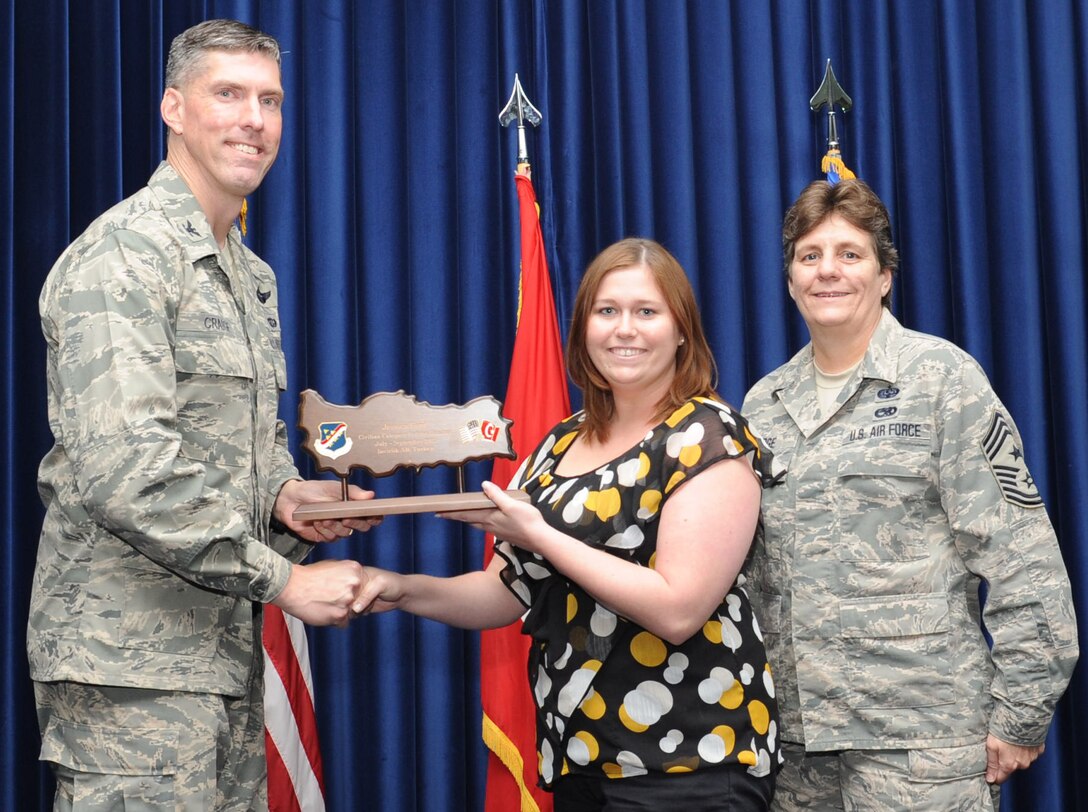 Jessica Ford, 728th Air Mobility Squadron, is presented a Civilian Category I of the Quarter Award at the club complex ballroom Oct. 31, 2012 at Incirlik Air Base, Turkey. Quarterly award and promotion ceremonies are a time-honored tradition across all branches of the armed forces. (U.S. Air Force photo by Senior Airman Daniel Phelps/ Released)
