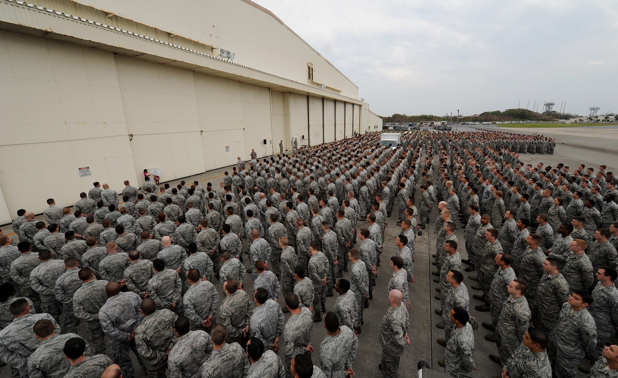 KADENA AIR BASE, Japan -- Col. Brian R. Beers, 18th Maintenance Group commander, briefs a formation of 18th MXG Airmen during a commander’s call at Kadena Air Base, Japan, Nov. 2, 2012. Kadena leadership held commanders calls for nearly 6,000 Airmen to explain how off-base incidents can impact the U.S./Okinawan relationship and undermine the wing's ability to conduct its mission in the region. The briefing also reminded them of the curfew policy in place and the need for all Airmen to be good ambassadors. (U.S. Air Force photo/Staff Sgt. Laszlo Babocsi)