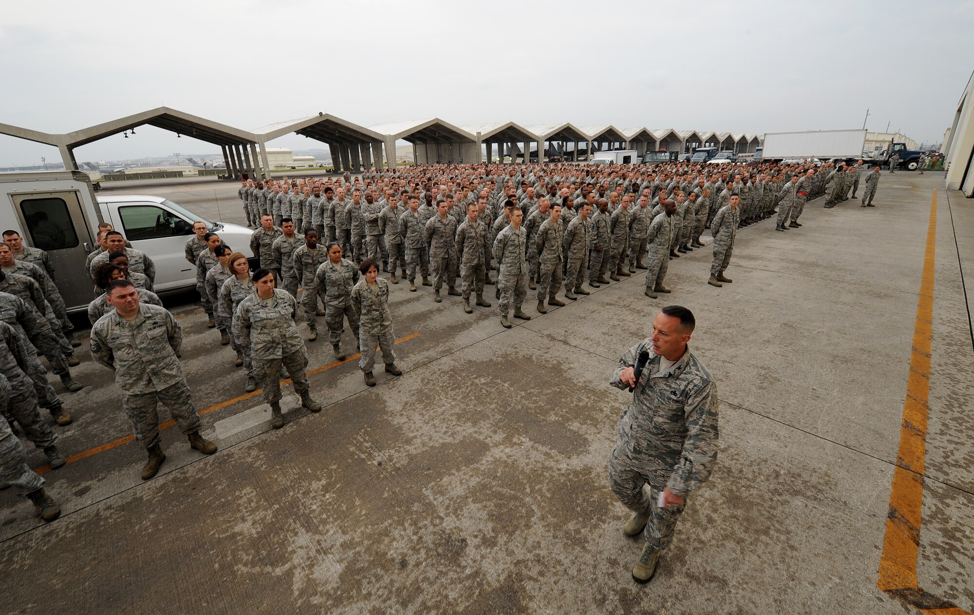 KADENA AIR BASE, Japan -- Col. Brian R. Beers, 18th Maintenance Group commander, briefs a formation of 18th MXG Airmen during a commander’s call at Kadena Air Base, Japan, Nov. 2, 2012. Kadena leadership held commanders calls for nearly 6,000 Airmen to explain how off-base incidents can impact the U.S./Okinawan relationship and undermine the wing's ability to conduct its mission in the region. The briefing also reminded them of the curfew policy in place and the need for all Airmen to be good ambassadors. (U.S. Air Force photo/Staff Sgt. Laszlo Babocsi)