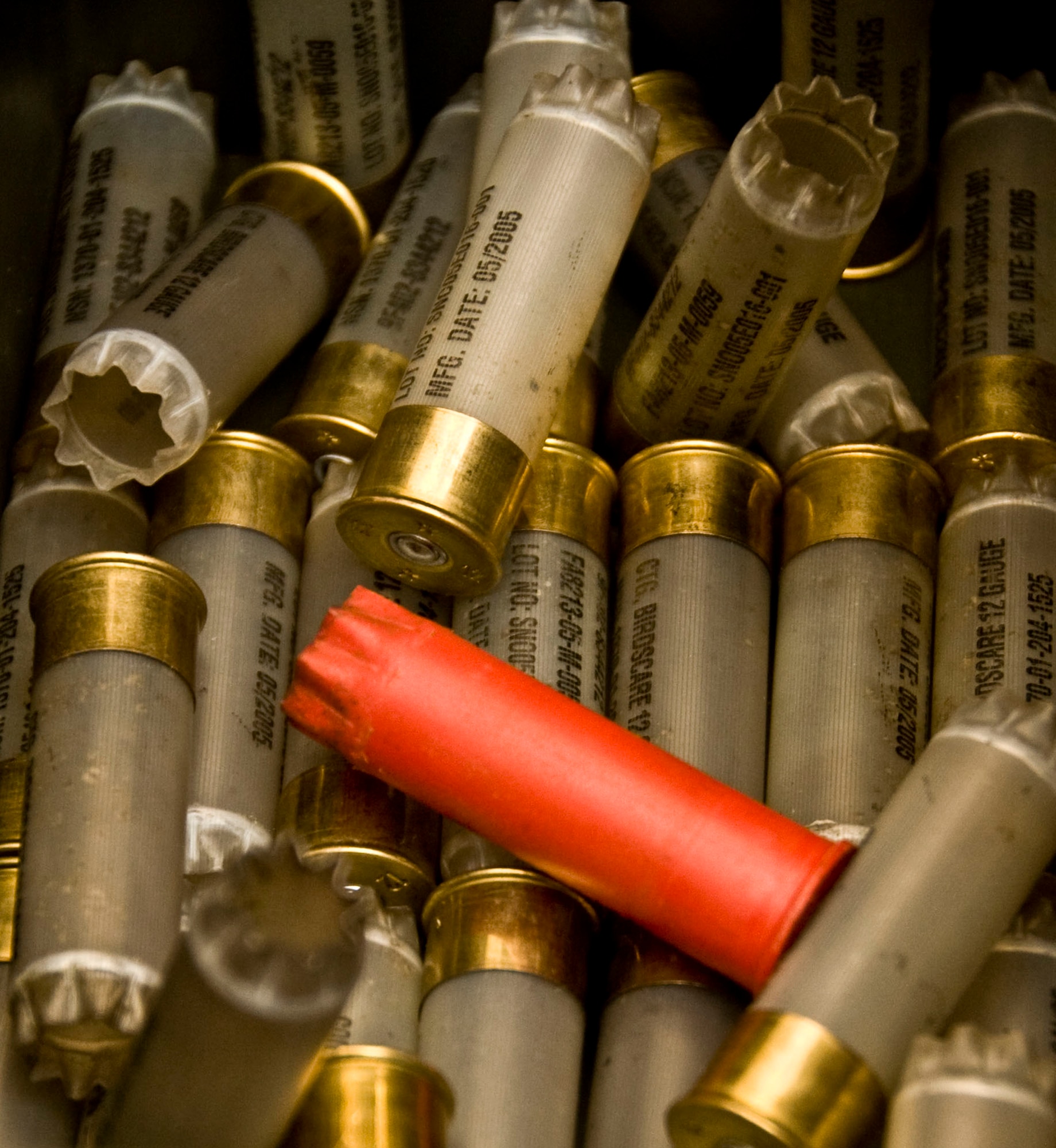 Empty 12 gauge birdscare shotgun cartridges are stored in a metal box in the 35th Operation Support Squadron base operations building at Misawa Air Base, Japan, Oct. 30, 2012. Bird strikes cause hundreds of deaths and approximately $75 million in military aircraft damage a year. (U.S. Air Force photo by Airman 1st Class Kenna Jackson)