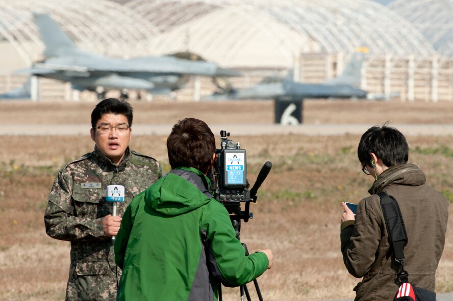 Hong Sung-Kyu, Channel A News, covers a story on Max Thunder 12-2 during Media Day at Kunsan Air Base, Republic of Korea, Oct. 31, 2012. Thirty nine media members from South Korean and foreign outlets documented U.S. and Republic of Korea air forces demonstrating their capabilities. (U.S. Air Force photo/Senior Airman Marcus Morris)