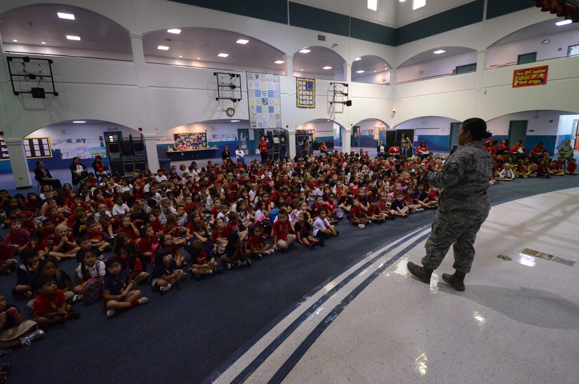 ANDERSEN AIR FORCE BASE, Guam—Master Sgt. Lisa Cruz, 254th Force Support Squadron Air National Guard civilian special programs manager, speaks to grade school children during Red Ribbon Week at Andersen Elementary School, Oct. 23. Red Ribbon Week is the nation's oldest and largest drug prevention program, reaching millions of Americans during the last week of October every year. (U.S. Air Force photo by Senior Airman Benjamin Wiseman/Released)