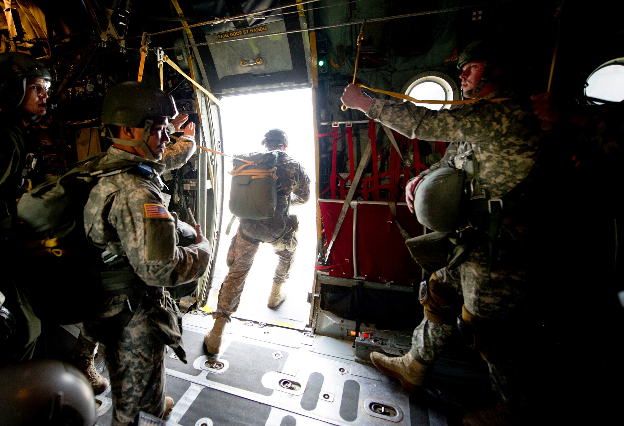 OVER JAPAN -- An Army Airborne soldier from Okinawa, Japan, jumps out the open door of a C-130 Hercules Oct. 30, 2012. The solders spent five days practicing static line jumps as well as high-altitude, low-opening jumps. (U.S. Air Force photo by Staff Sgt. Stacy Moless)