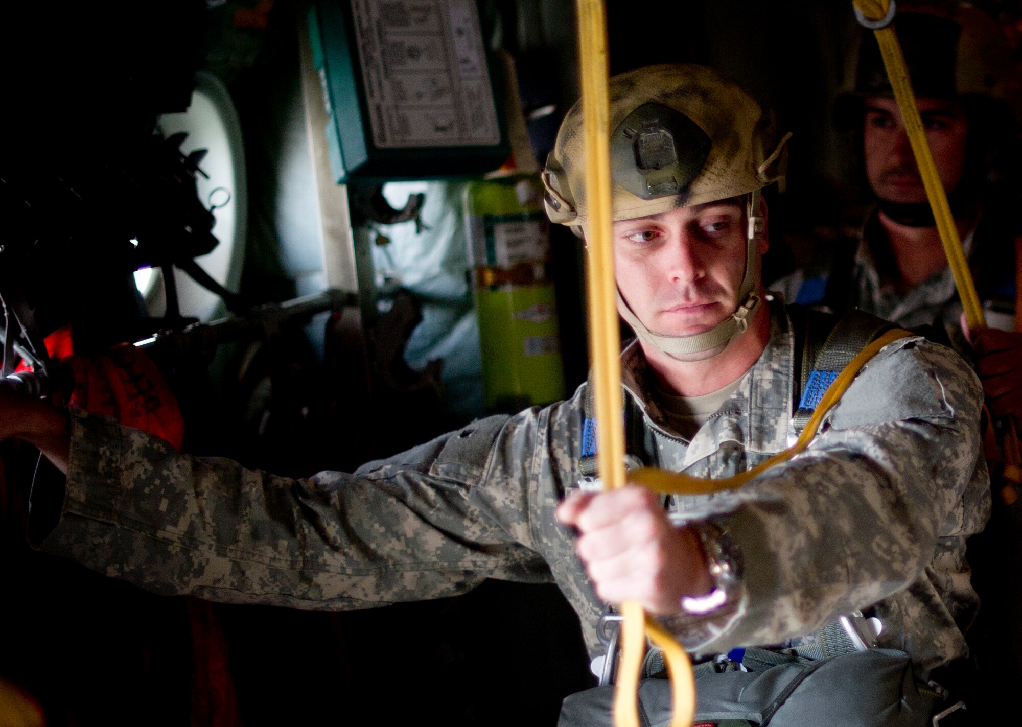 OVER JAPAN -- An Army Airborne soldier from Okinawa, Japan waits his turn to perform his static line jump Oct. 30, 2012 at Yokota Air Base, Japan. During a static line jump the parachute is linked to the aircraft allowing the parachute to open without manual assistance. (U.S. Air Force photo by Staff Sgt. Stacy Moless)