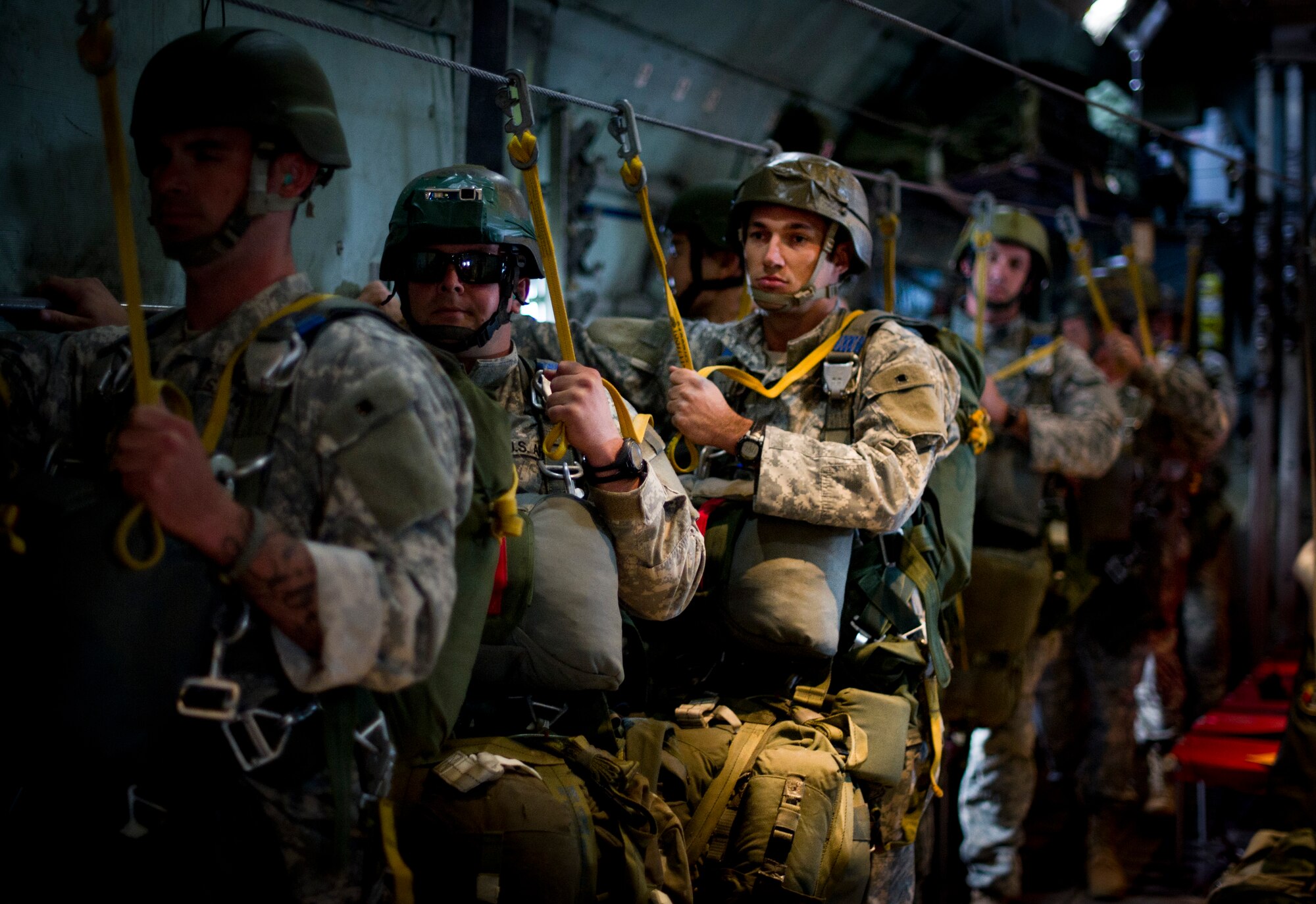 OVER JAPAN -- Army Airborne soldiers from Okinawa, Japan, stand in line on a C-130 Hercules waiting to complete their training jump at Yokota Air Base, Japan, Oct. 30, 2012. The 374th Aircraft Maintenance Squadron at Yokota Air Base, Japan supports the every 90 day training requirement for the solders by supplying and maintaining the aircraft used for the jumps. (U.S. Air Force photo by Staff Sgt. Stacy Moless)