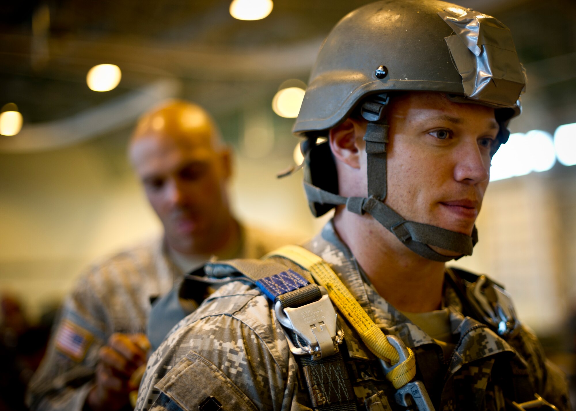 YOKOTA AIR BASE, Japan -- An Army Airborne soldier from Okinawa, Japan, waits while his jumpmaster inspects his equipment Oct. 30, 2012, at Yokota Air Base, Japan. For safety purposes, the inspection is done before every jump by a qualified jumpmaster. (U.S. Air Force photo by Staff Sgt. Stacy Moless)