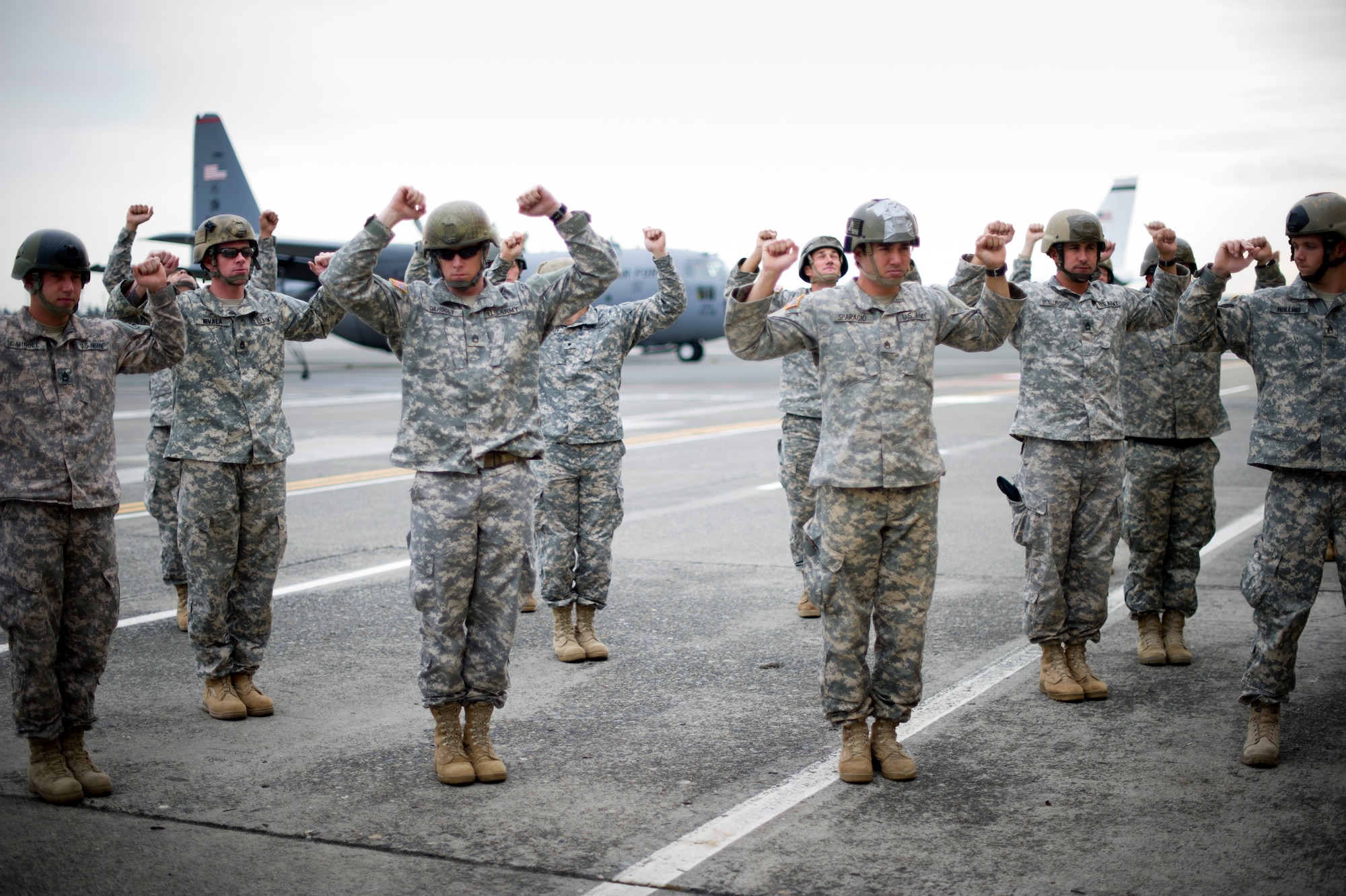 YOKOTA AIR BASE, Japan -- Army Airborne soldiers from Okinawa, Japan, practice jump maneuvers before a training jump at Yokota Air Base, Japan, Oct. 30, 2012. Completing this training every 90 days keeps the jumpers ready to deploy throughout the Pacific region. (U.S. Air Force photos by Staff Sgt. Stacy Moless)