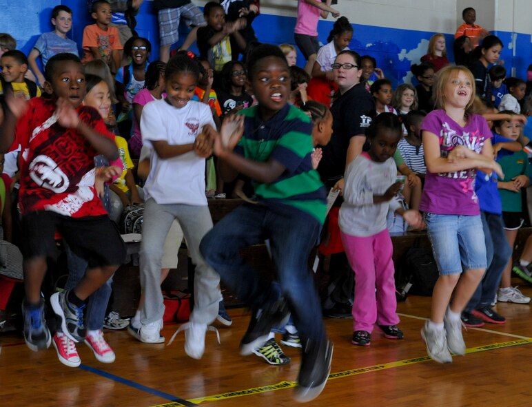 Children dance to a song called Gangnam Style, during a prep rally at the Kadena Teen Center on Kadena Air Base, Japan, Nov. 2, 2012. The Toy Industry Foundation in conjunction with the Boys & Girls Club of America gave away nearly 2000 toys to military members' children stationed at Kadena. (U.S. Air Force photo/Airman 1st Class Justin Veazie)