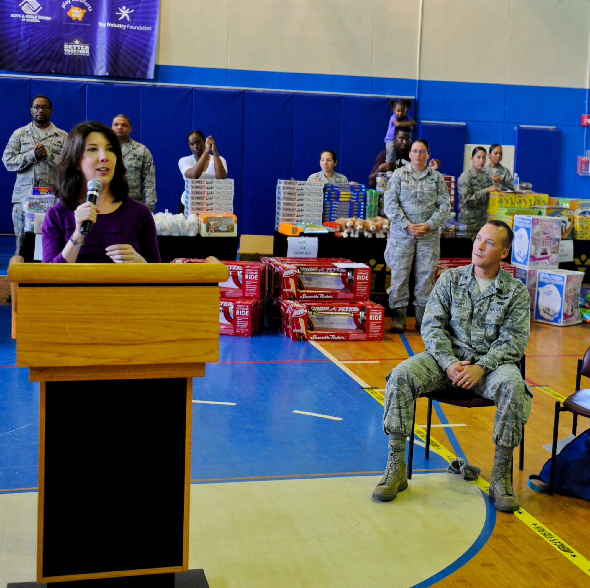 Jean Butler, executive director of the Toy Industry Foundation, talks to children at the Kadena Teen Center during the prep rally on Kadena Air Base, Japan, Nov. 2, 2012. Play Comforts Toy Giveaway is an international event and it was the first year that Kadena was selected. (U.S. Air Force photo/Airman 1st Class Justin Veazie)