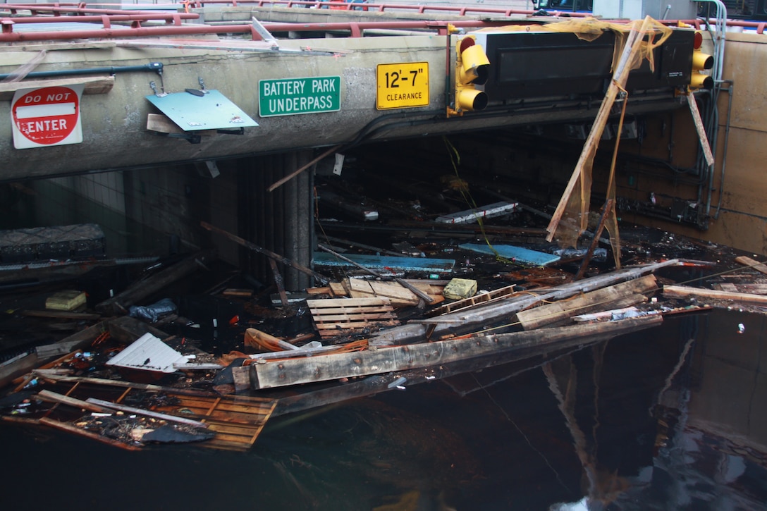 Floating drift clogs the Battery Park Underpass after Hurricane Sandy inundated lower Manhattan with a record level storm surge. As part of the national response framework for Hurricane Sandy, the U.S. Army Corps of Engineers in support of FEMA is making steady progress to assist local, city, and state officials in the aftermath of Hurricane Sandy.  The Corps will be overseeing pump operations to get an estimated 10 million gallons of water out of the Battery Park Underpass, which is estimated to take 24 hours to complete.