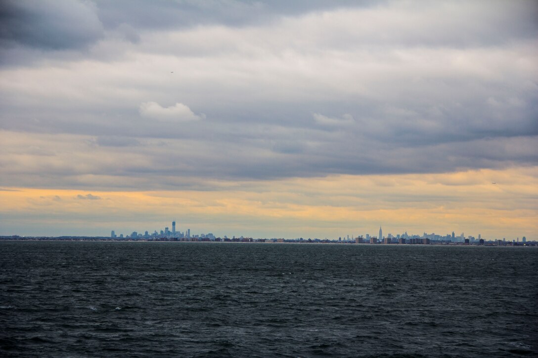 New York City is visible from the deck of USS Wasp, where Marines and sailors of the 26th Marine Expeditionary Unit embarked aboard, Nov. 1, 2012, to assist in disaster relief efforts in the aftermath of Hurricane Sandy. The 26th MEU is able to provide generators, fuel, clean water, and helicopter lift capabilities to aid in disaster relief efforts. The 26th MEU is currently conducting pre-deployment training, preparing for their departure in 2013. As an expeditionary crisis response force operating from the sea the MEU is a Marine Air-Ground Task Force capable of conducting amphibious operations, crisis response, and limited contingency operations. (U.S. Marine Corps photo by Cpl. Michael S. Lockett/Released)