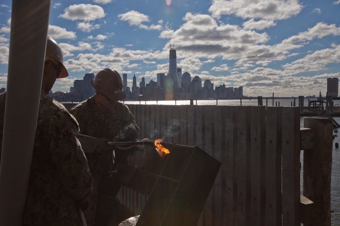 Marines and sailors work to repair a pier in Hobobken, N.J., Nov. 3. The Navy-Marine Corps team is well-equipped to respond to national disasters when required, through the coordination of U.S. Northern Command.  While the military plays an important role in disaster response, all our efforts are in support of FEMA first and foremost, who coordinate closely with state and local officials.