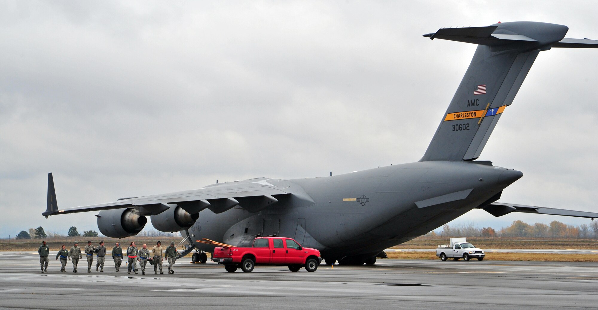 This is the second C-17 Globemaster assigned to Joint Base Charleston, S.C., which took off this afternoon from Fairchild Air Force Base, Wash., for Joint Base McGuire Dix Lakehurst, N.J., Nov. 3. A total of 19 Bonneville Power Administration employee volunteers from the Spokane region and 14 of their vehicles will make their way to Long Island, New York to help restore power that was knocked out by Hurricane Sandy. (U.S. Air Force photo by Airman 1st Class Taylor Curry)


