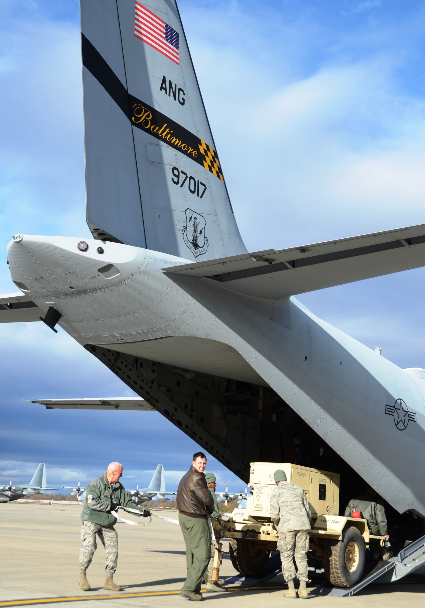 Members of the New York Air National Guard unload an electrical generator from a C-27J Spartan at Stewart Air National Guard Base in New York on Saturday, November 3, 2012. The mission critical equipment is being transported by the Maryland Air National Guard for relief efforts in New York City due to Hurricane Sandy. (National Guard photo by Tech. Sgt. David Speicher)