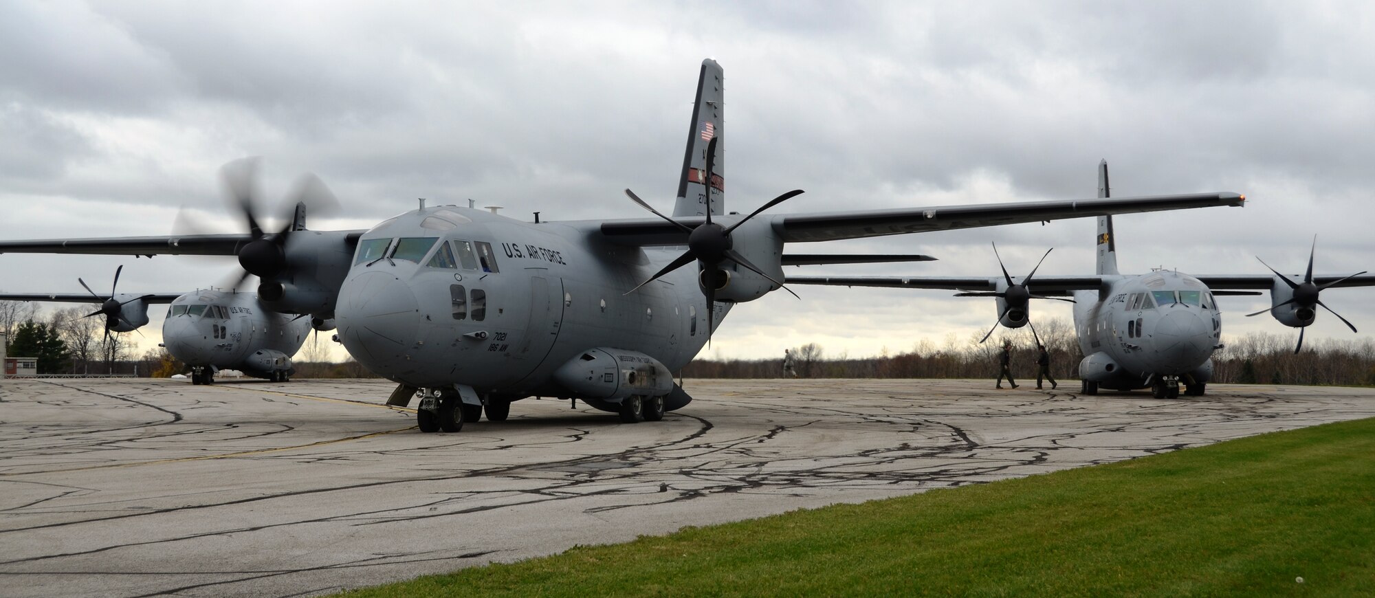 Three C-27J Spartans wait at the Akron-Canton Airport in Ohio on Saturday, November 3, 2012 to upload mission critical equipment in support of disaster relief from Hurricane Sandy. Cargo planes from Maryland, Mississippi and Ohio National Guard units transported electrical generators to be used in the New York City area. (National Guard photo by Tech. Sgt. David Speicher)