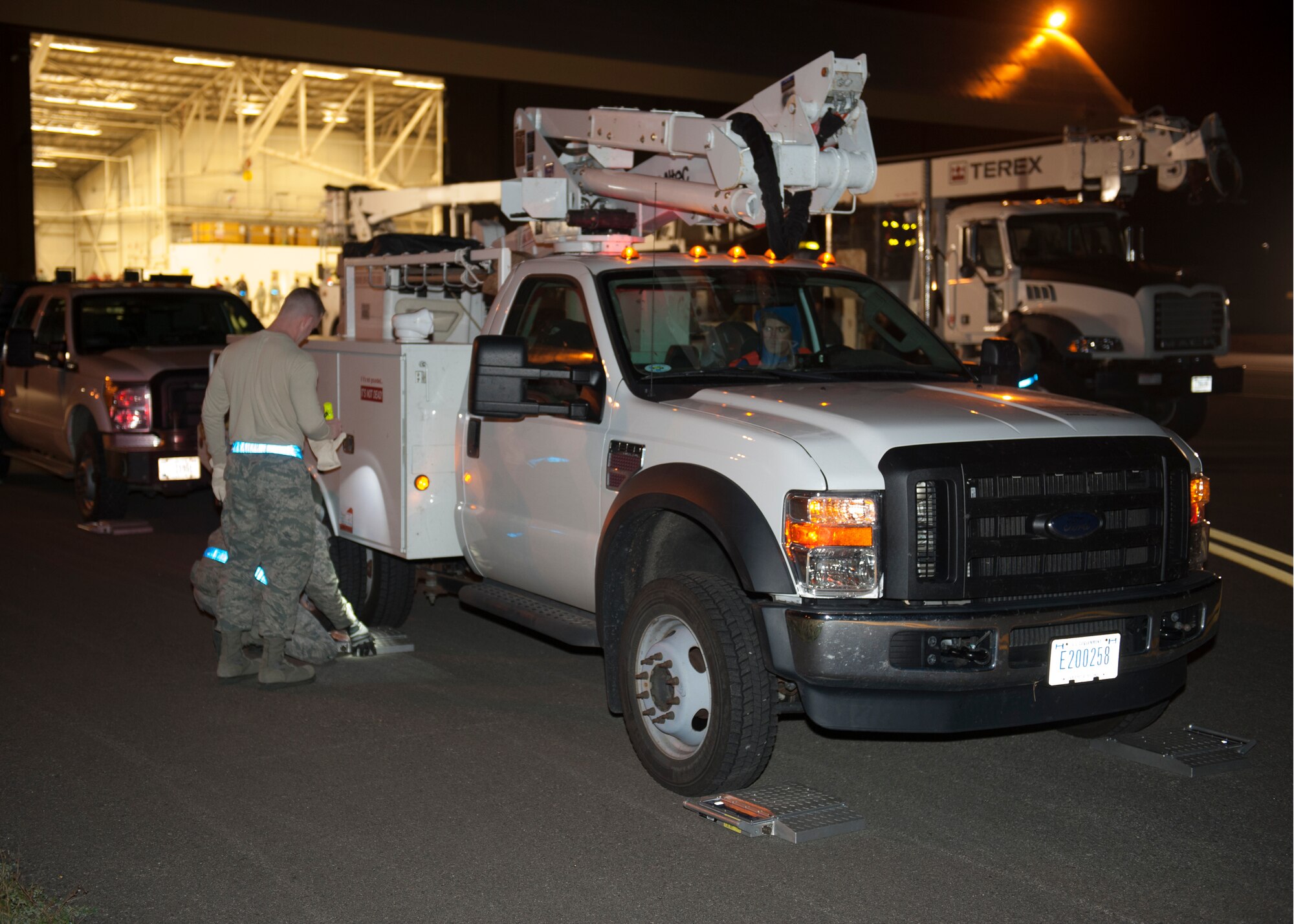 Fourteen support and utilities vehicles from Spokane-area Bonneville Power Administration arrived at Fairchild Air Force Base, Wash., Nov. 2, 2012 at approximately 9 p.m. Airmen from the Logistics Readiness Squadron began to weigh measure and perform safety inspections on all vehicles to prepare them for flight by 10 p.m. All vehicles were ready within six hours. (U.S. Air Force photos by Staff Sgt. Michael Means)